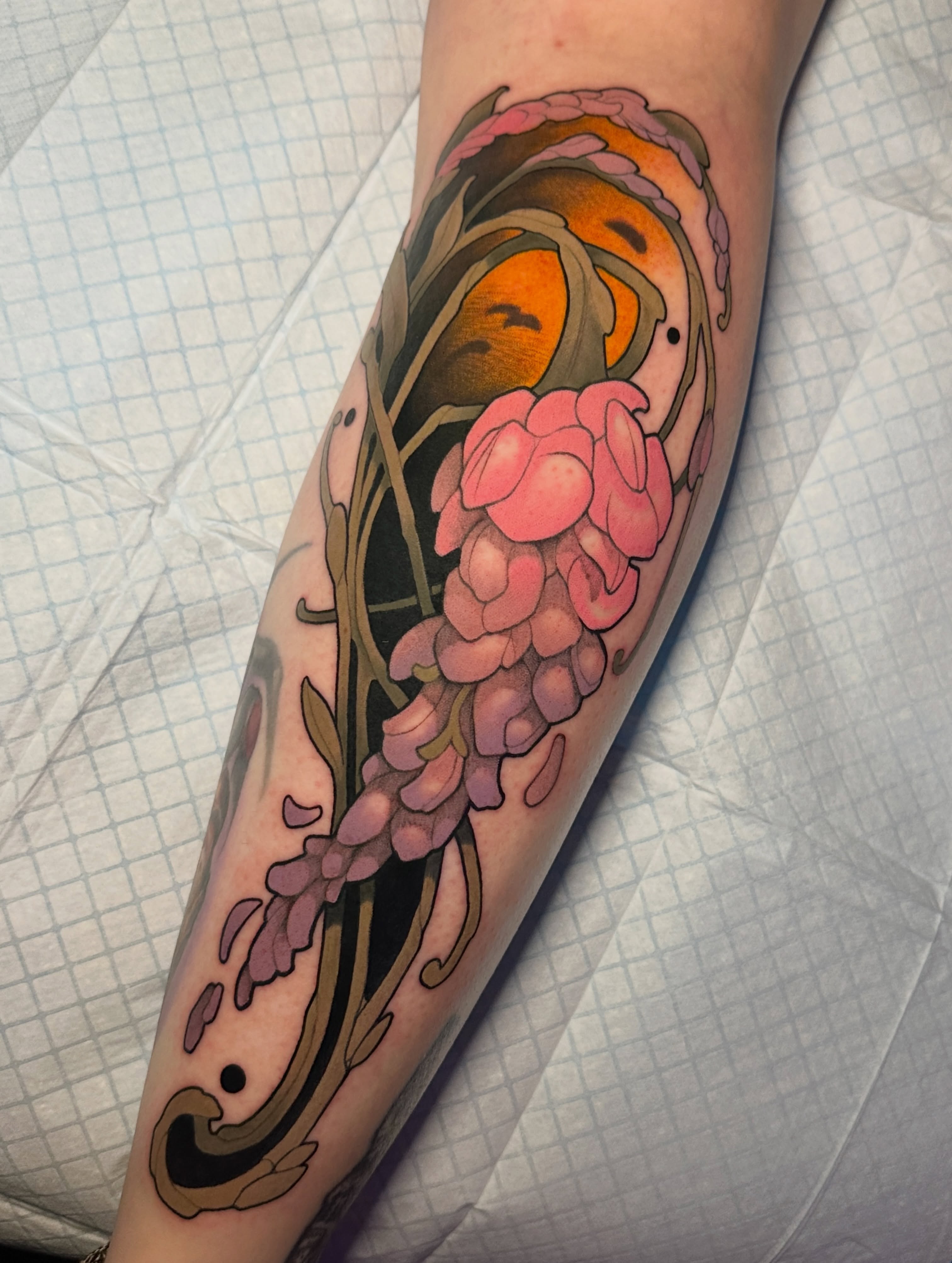 Wisteria and sun new school tattoo on the forearm by Skylar Mangrum
