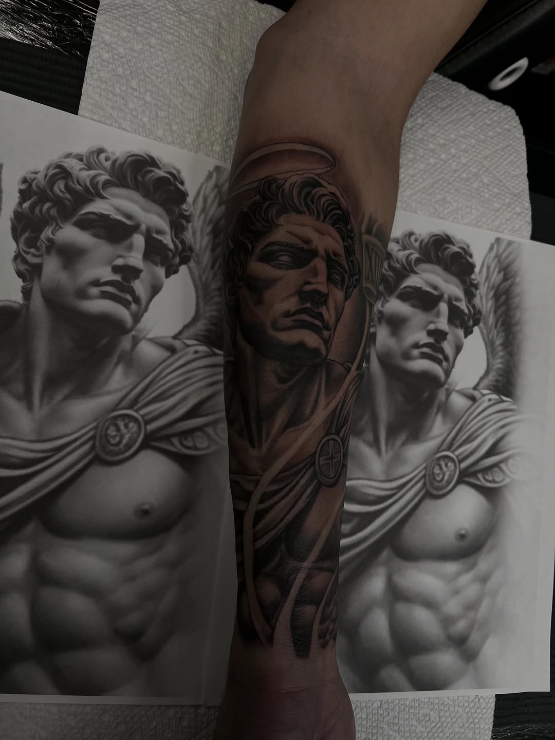 Angelic figure realism tattoo on the forearm by Hugo Ruiz-Esparza