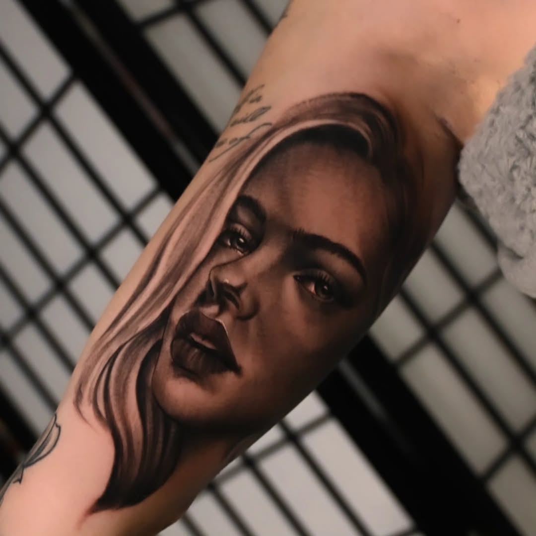 Portrait of a woman realism tattoo on the forearm by Michael ORegan