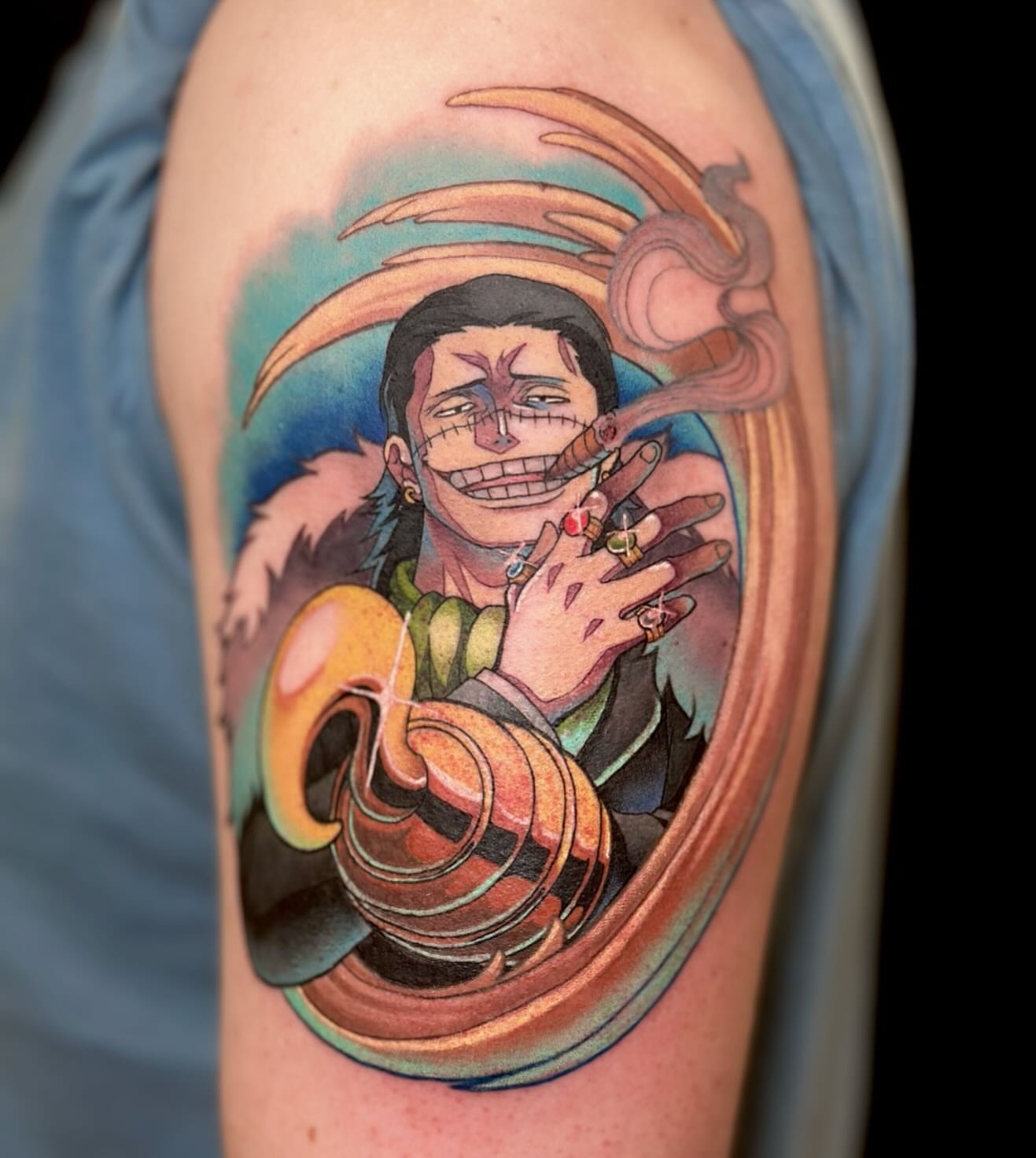 Smiling character anime tattoo on the upper arm by πππ£π£π β‘β§βΛ