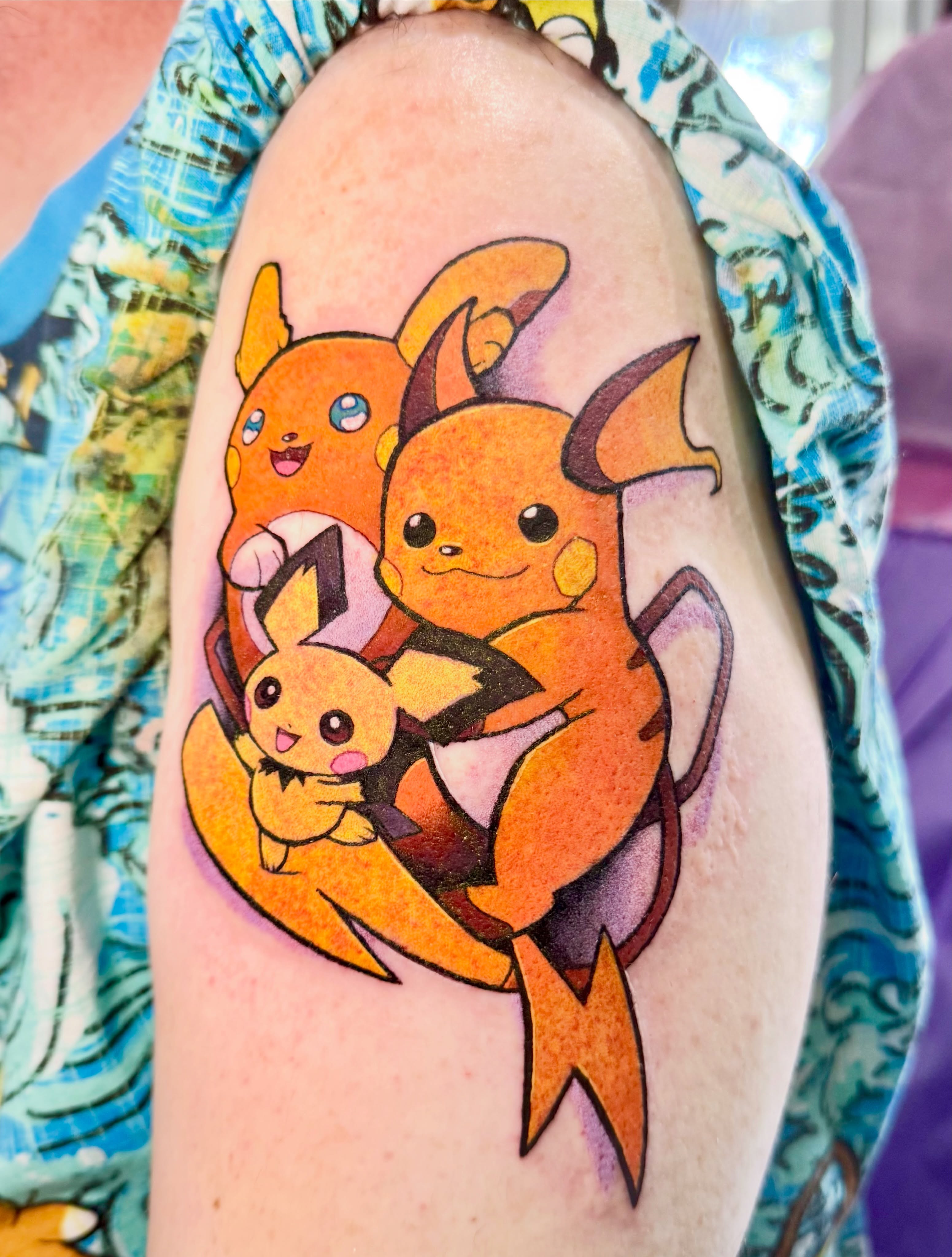 Charmander family anime tattoo on the forearm by Joey Topacio