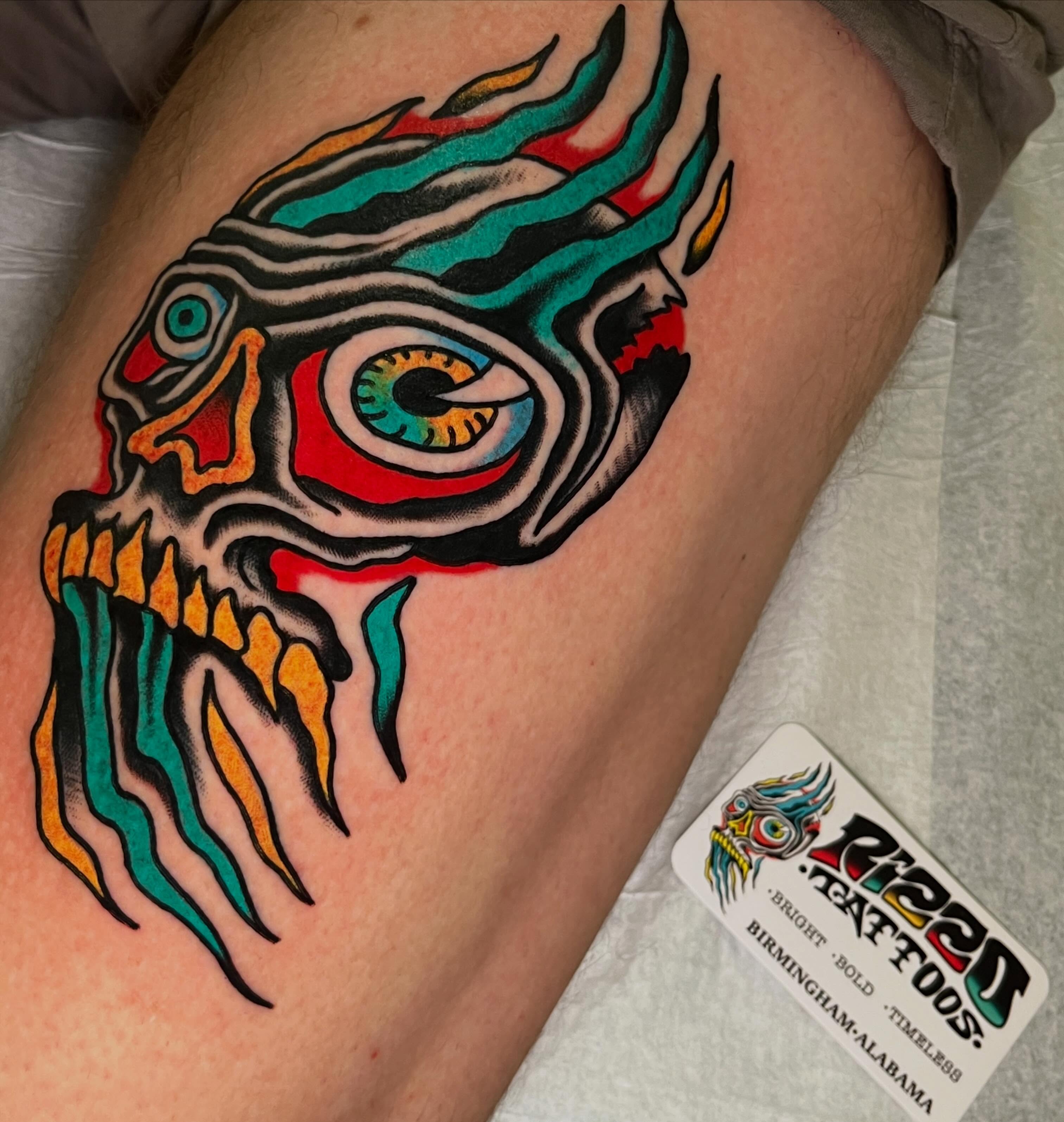 Mask American traditional tattoo on the thigh by Rizzo