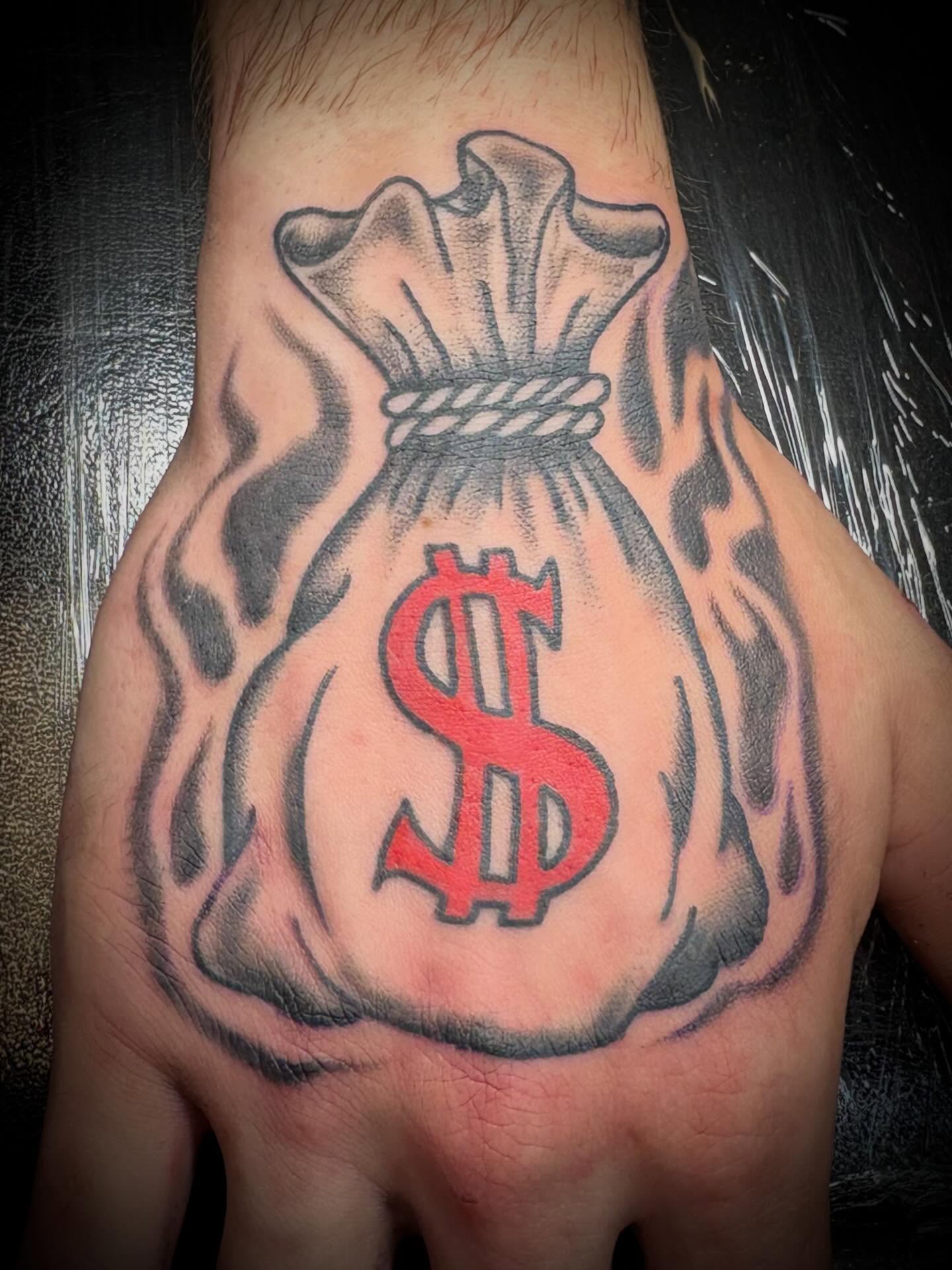 Money bag black and grey tattoo on the thigh by Gardner, Gardner, Massachusetts