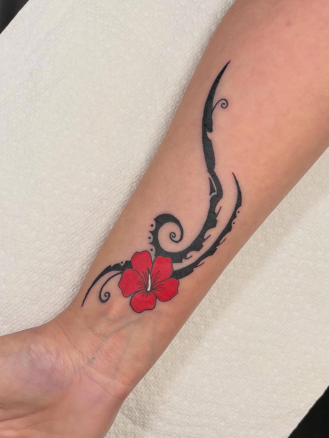 Hibiscus flower with tribal elements tribal tattoo on the forearm by ππ‘ππ―π² πππ₯π₯ππ²