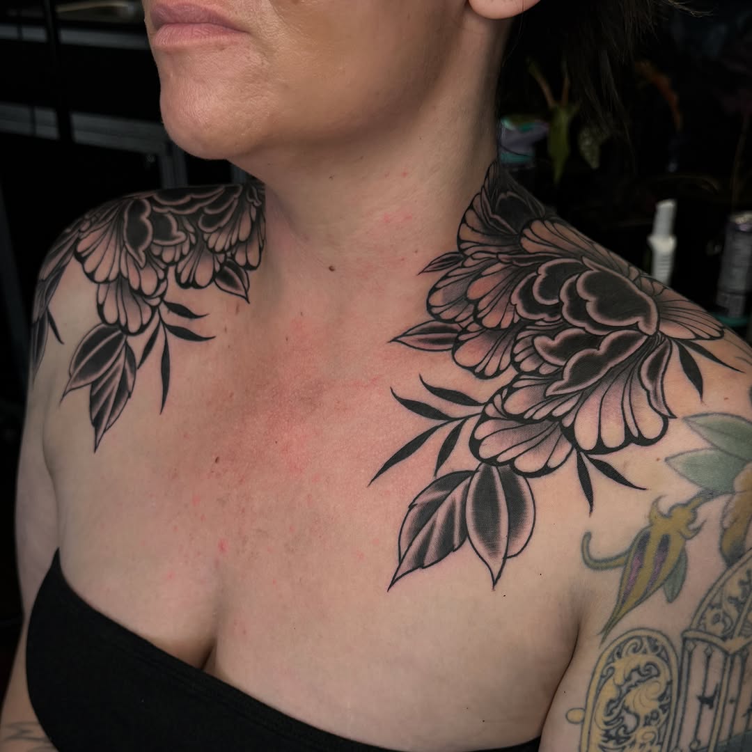 Floral black and grey tattoo on the chest by Bre Grover, Vancouver, British Columbia