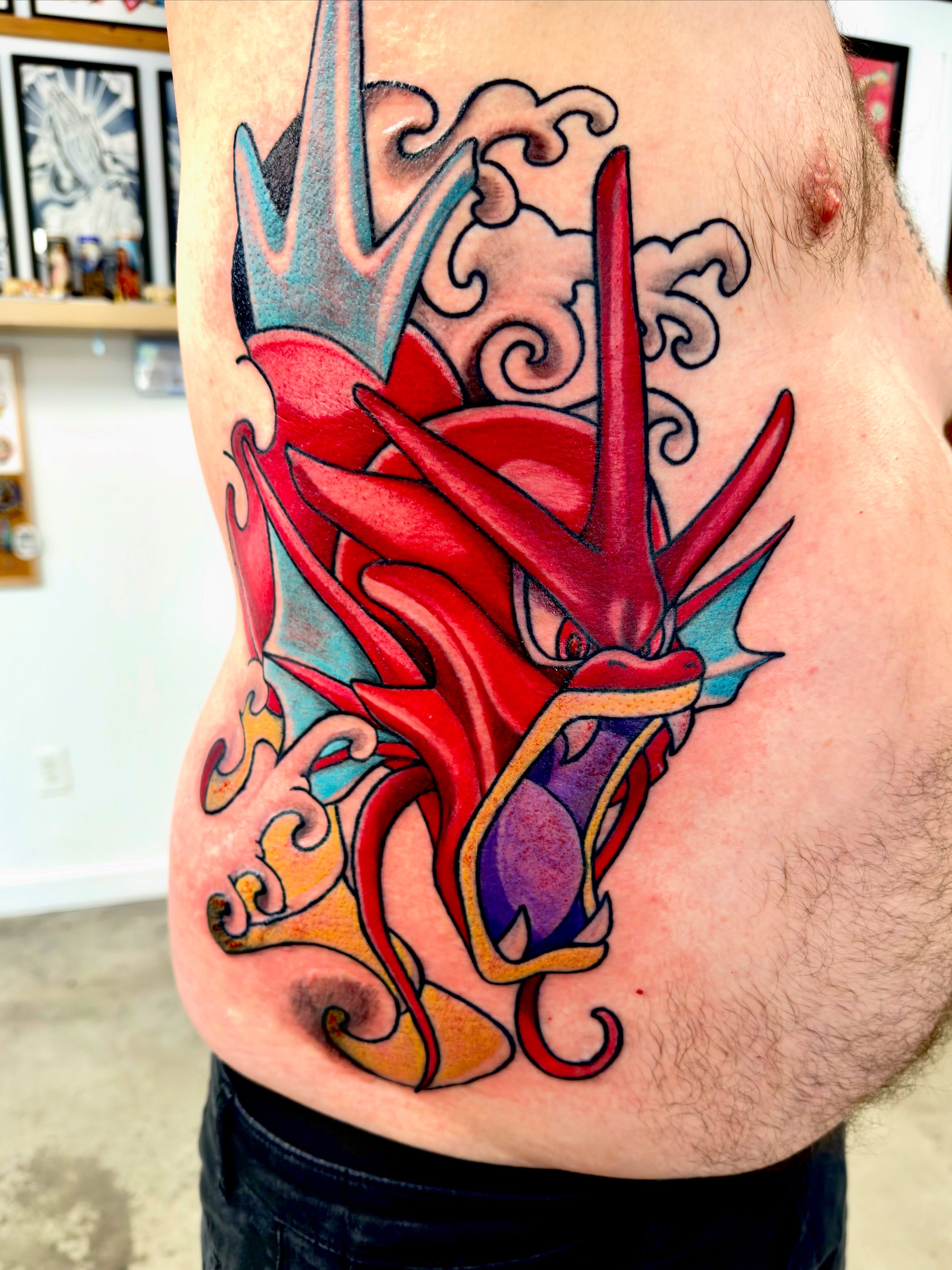 Dragon new school tattoo on the thigh by Christopher Layman