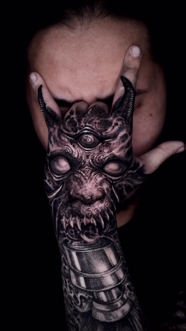 Demonic face on hand and forearm realism tattoo on the forearm by Dark tattoo