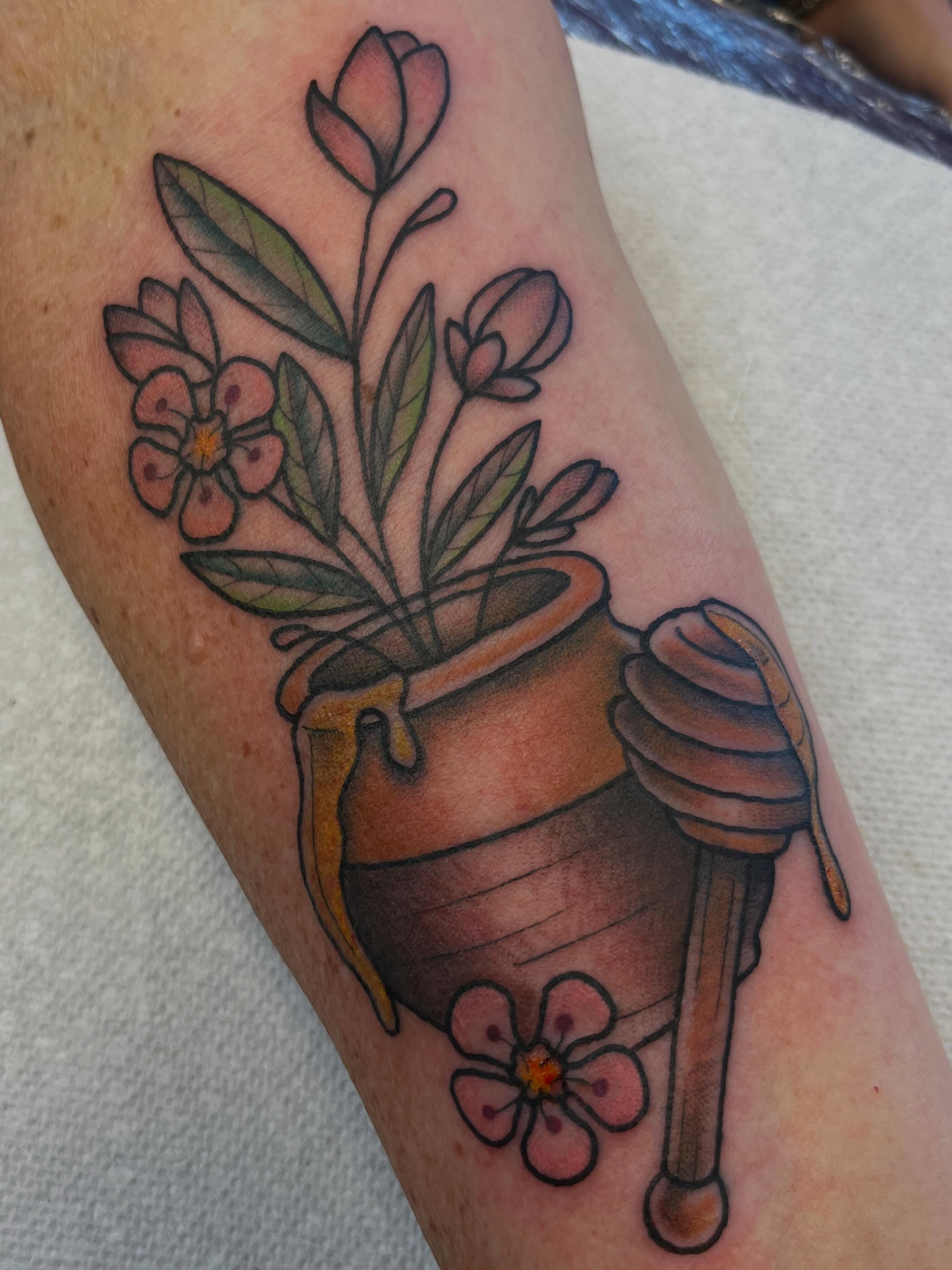 Flower pot with bee neo-traditional tattoo on the forearm by Danielle Lorandeau