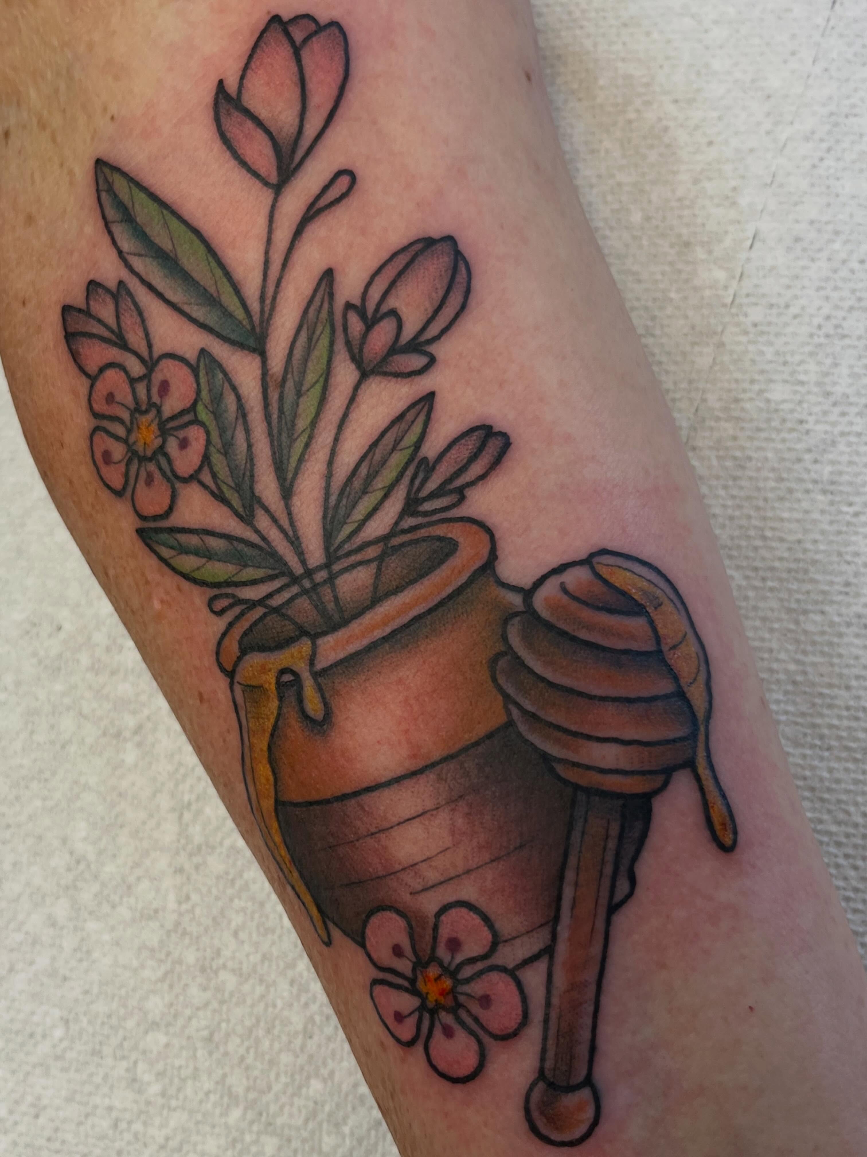 Flower pot and honey dipper American traditional tattoo on the forearm by Danielle Lorandeau