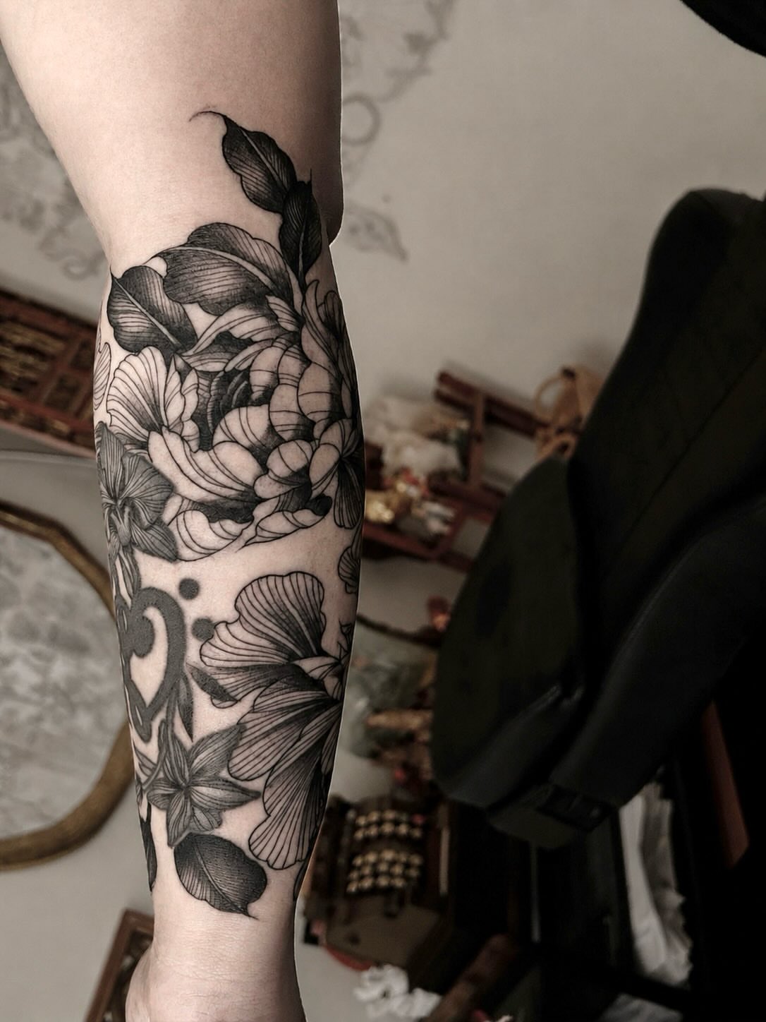 Floral bouquet black and grey tattoo on the forearm by Jonny Tattoo PHX AZ