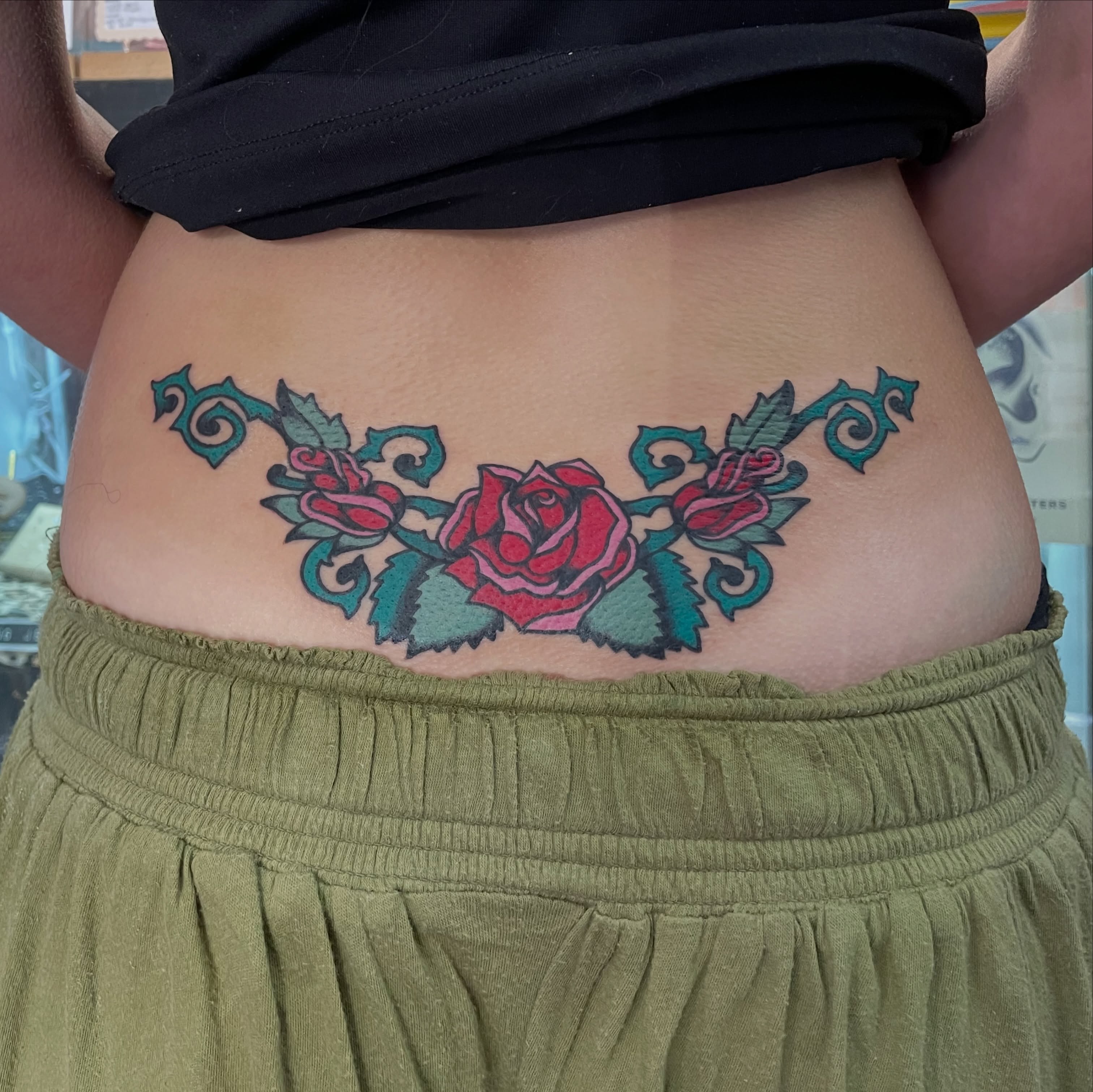 Roses American traditional tattoo on the torso by zoe ๐