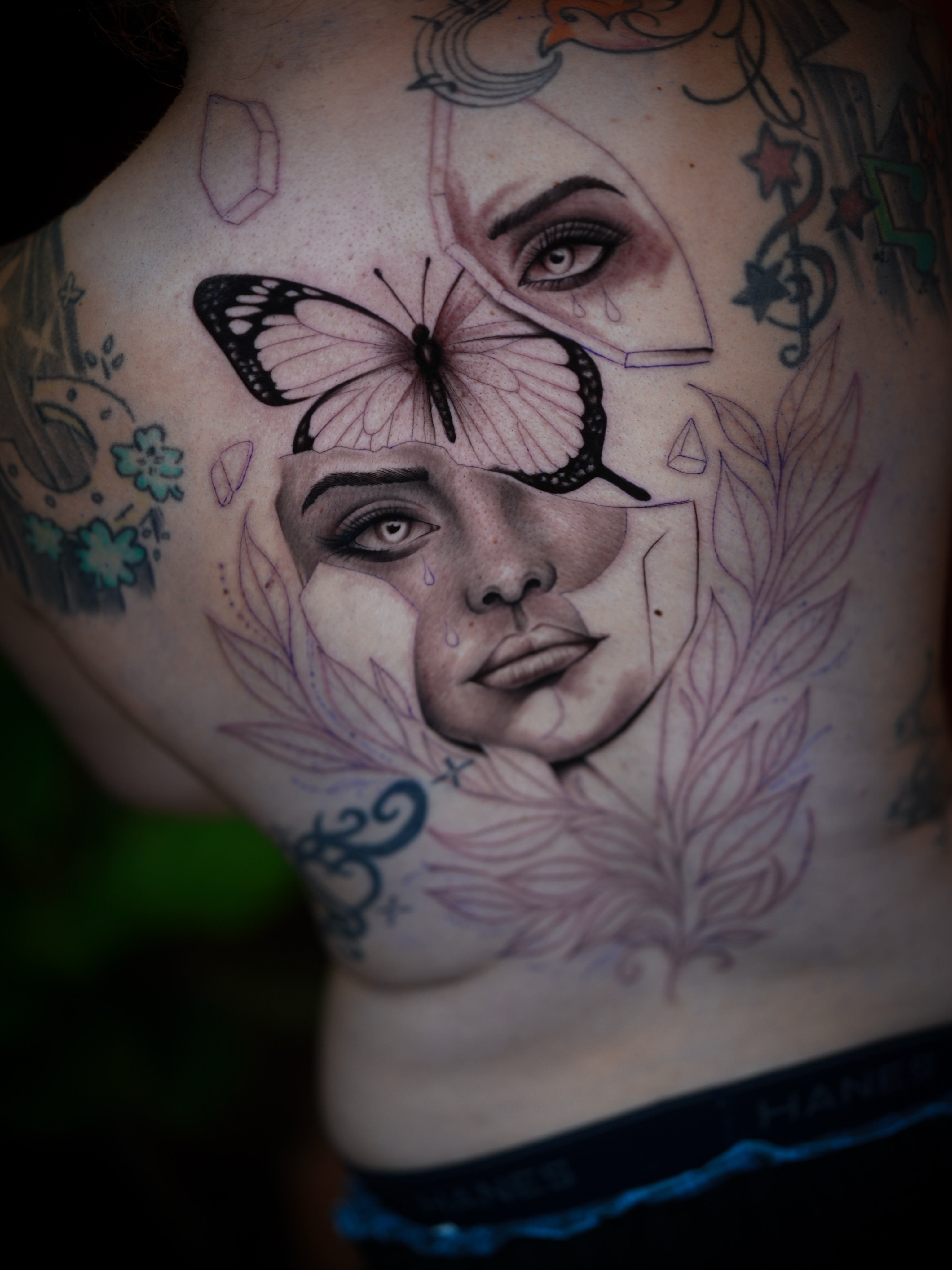 Woman's face realism tattoo on the chest by Franz Muñoz