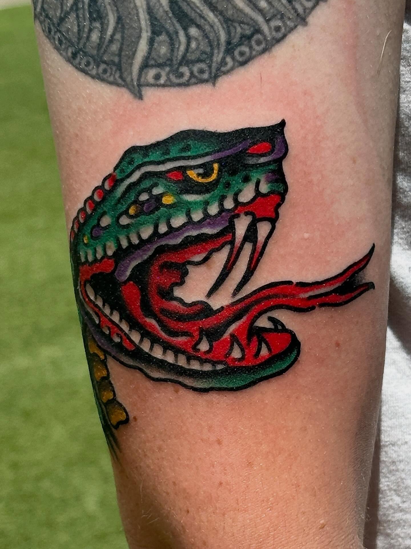 Snake American traditional tattoo on the forearm by Jared Allen, Saint Petersburg, Florida