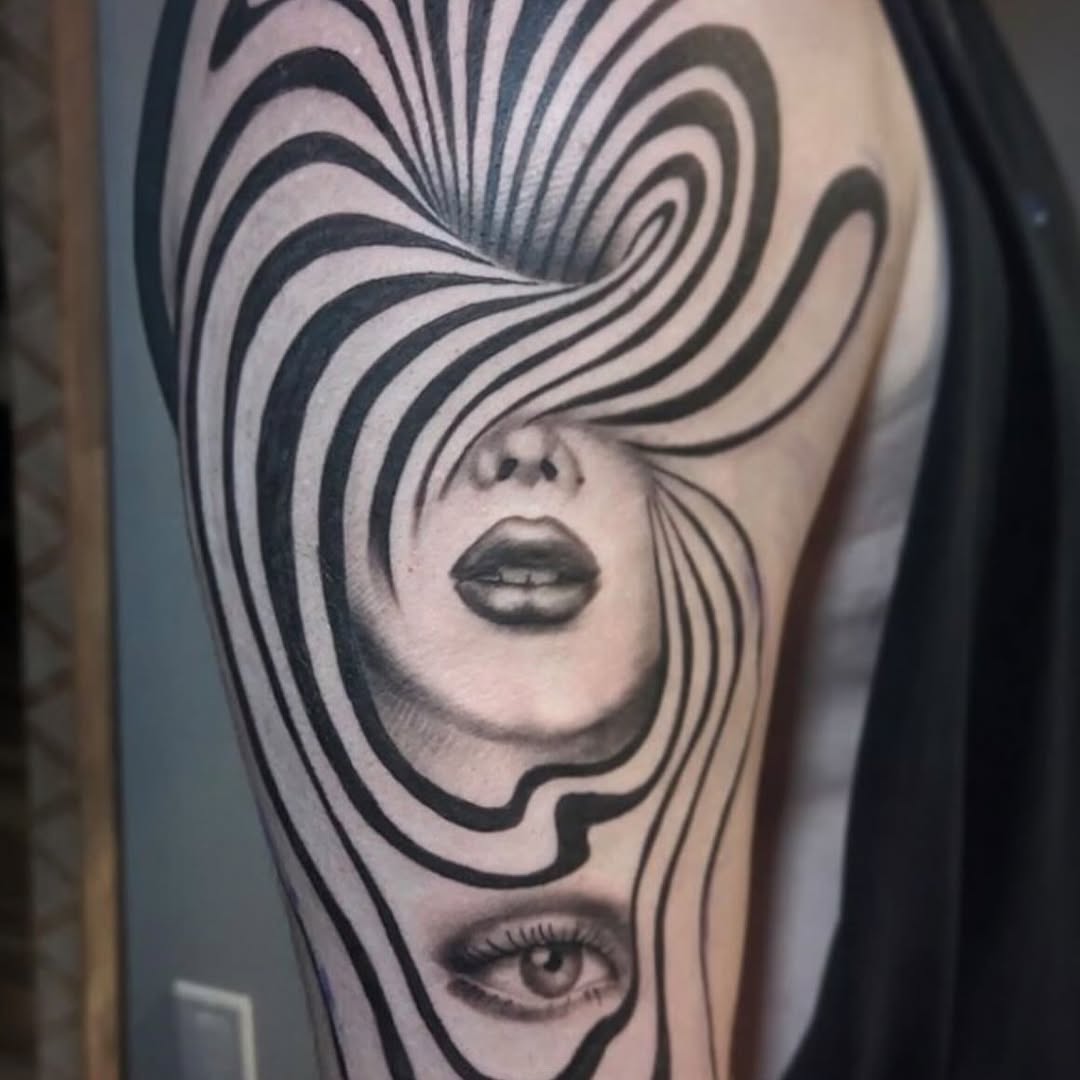 Surreal face and eye surrealism tattoo on the forearm by Cassandra Colleen
