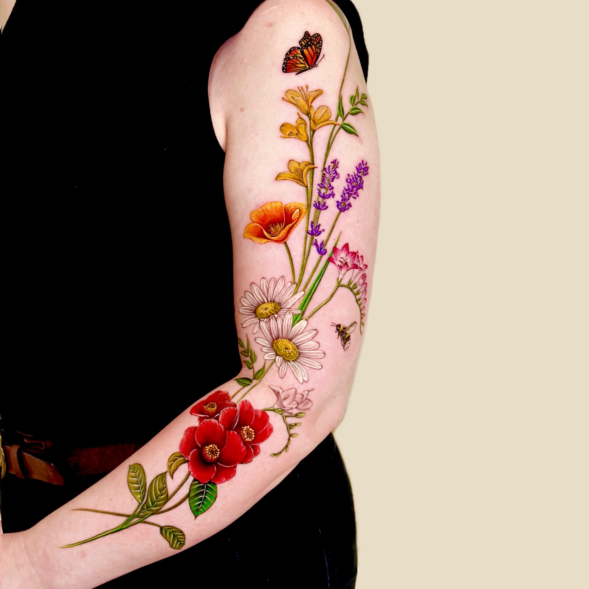 Floral bouquet realism tattoo on the forearm by Claire