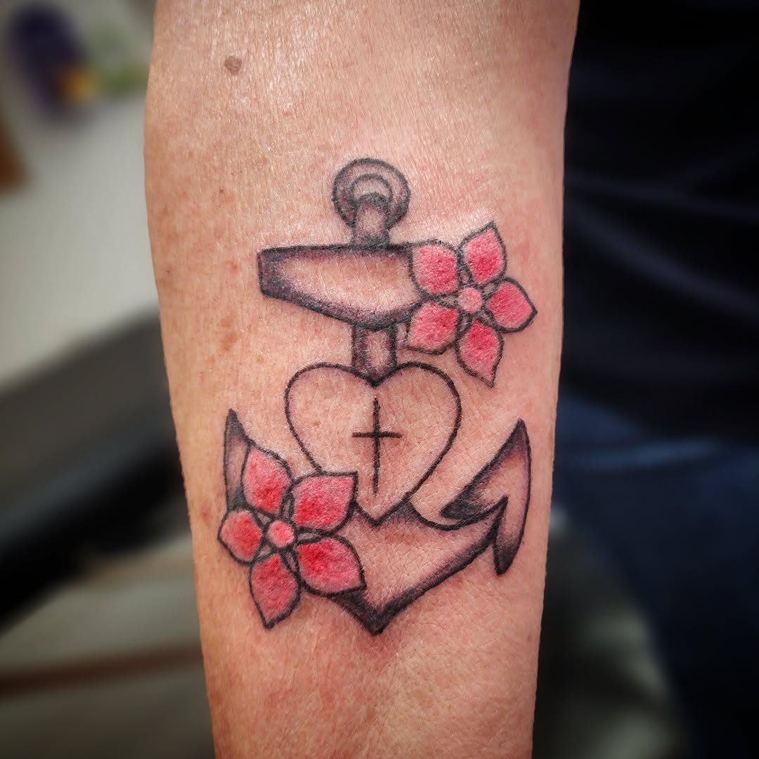 Anchor with heart and flowers American traditional tattoo on the forearm by Anntonietta Borzacchiello