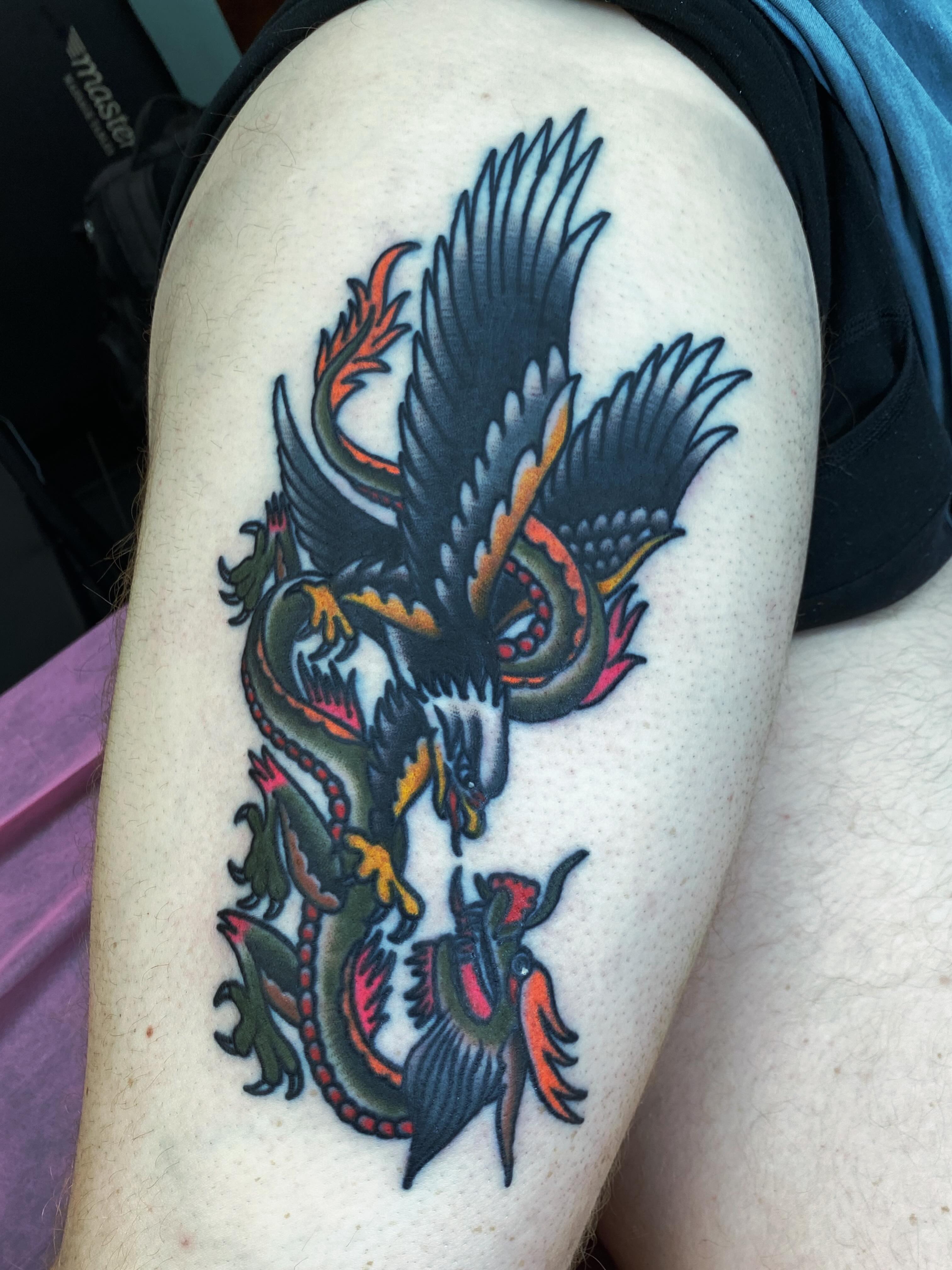Dragon American traditional tattoo on the thigh by Houston tattoo artist