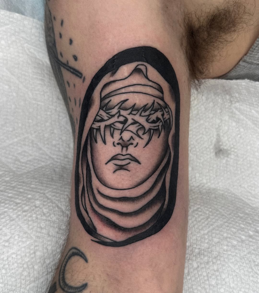 Religious figure black and grey tattoo on the forearm by nicky joe