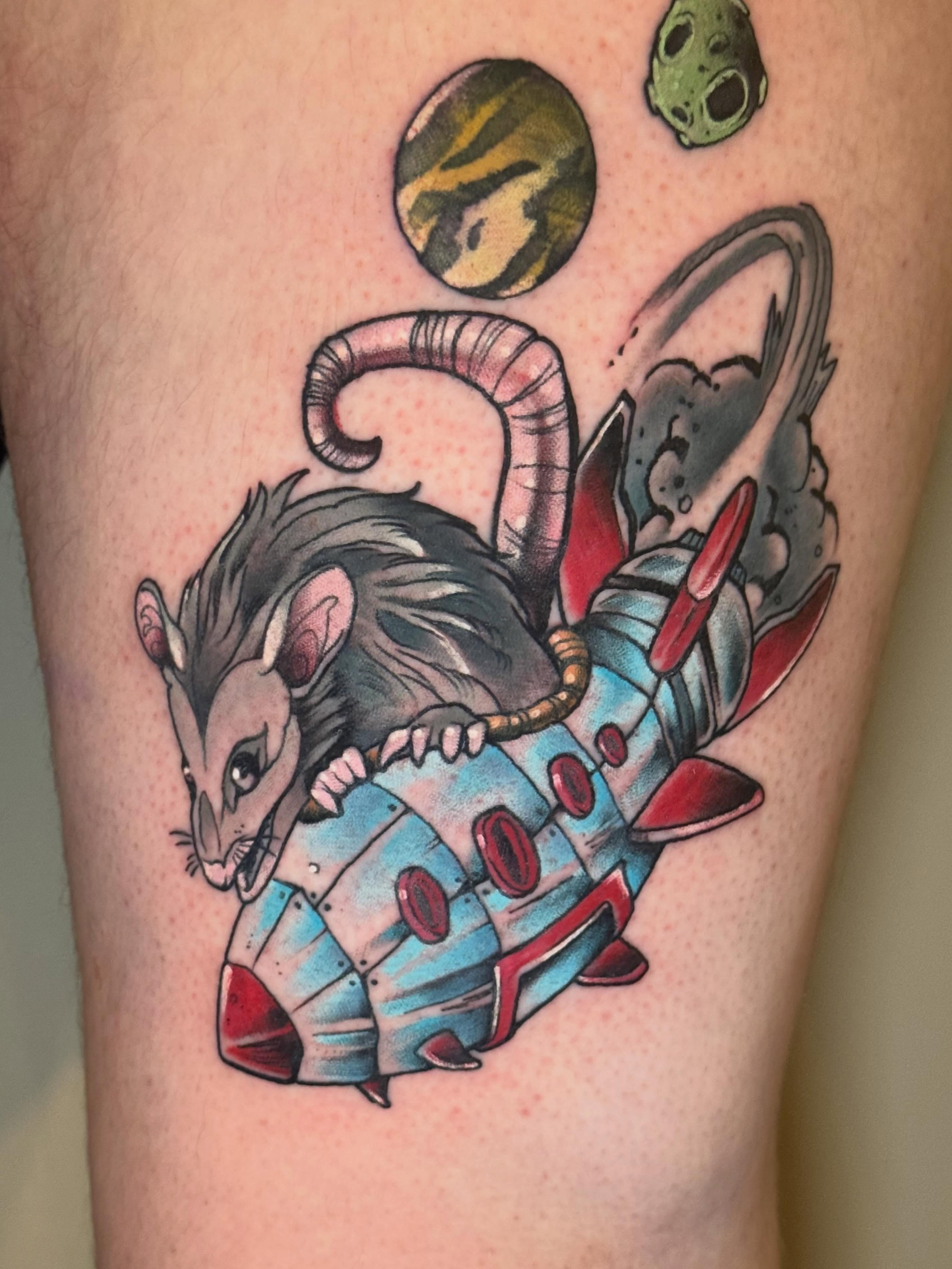 Possum in spaceship American traditional tattoo on the thigh by Mike Bean, Minneapolis, Minnesota