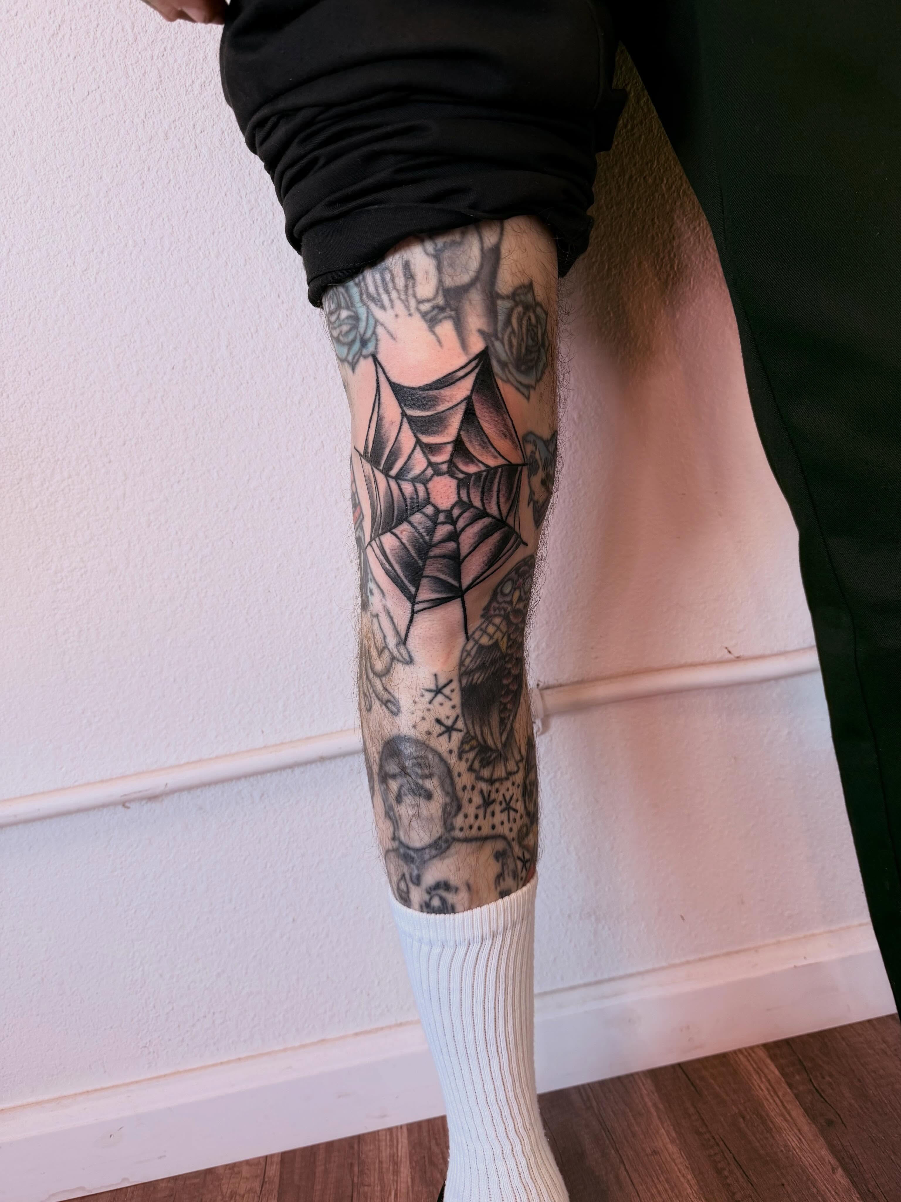 Spider web geometric tattoo on the calf by Jessica Abbey