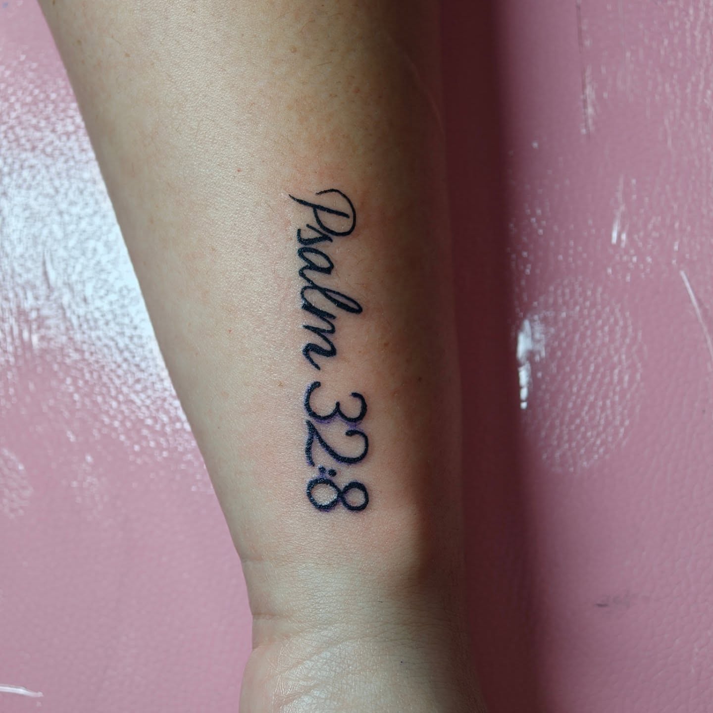 Psalm 32:8 lettering script tattoo on the forearm by Dani Sandoval, Anaheim, California