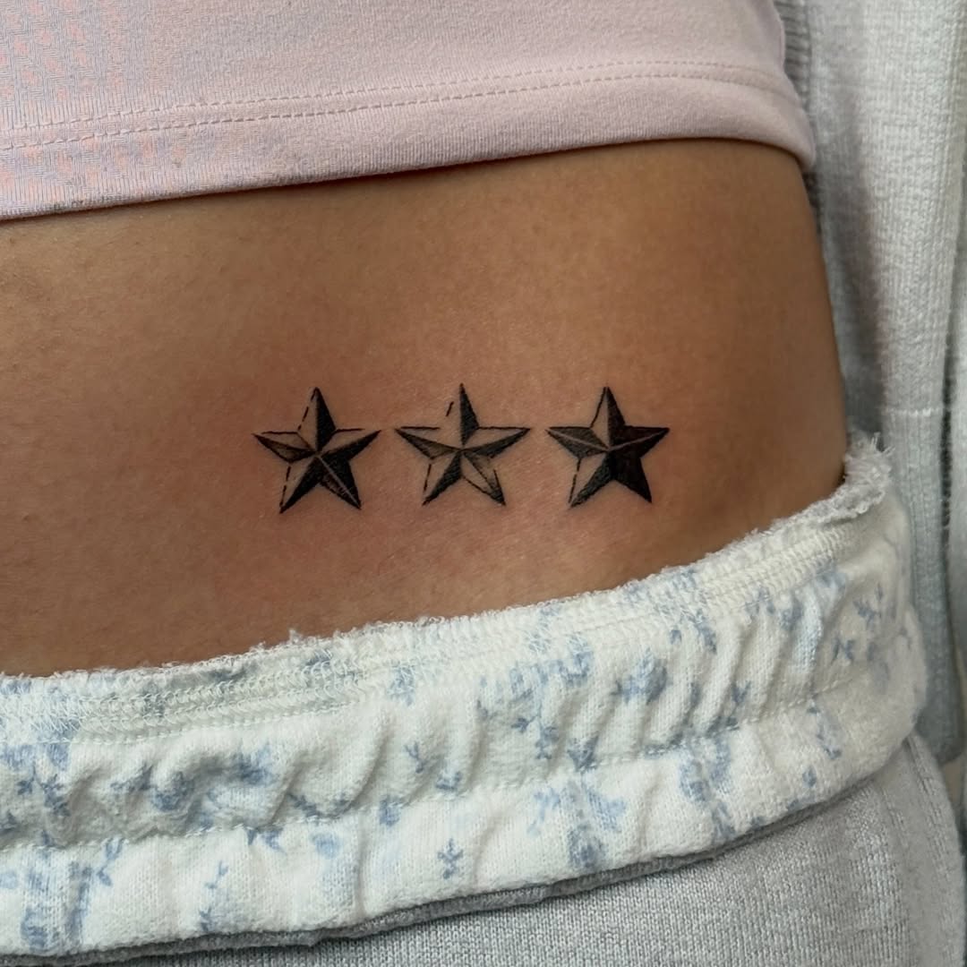 Three stars fine line tattoo on the ribs by Kirsten