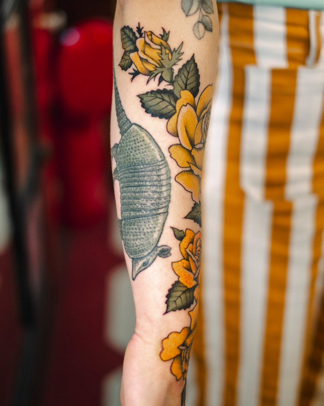 Yellow roses and beetle dotwork tattoo on the forearm by Dan Gilsdorf, Portland, Oregon