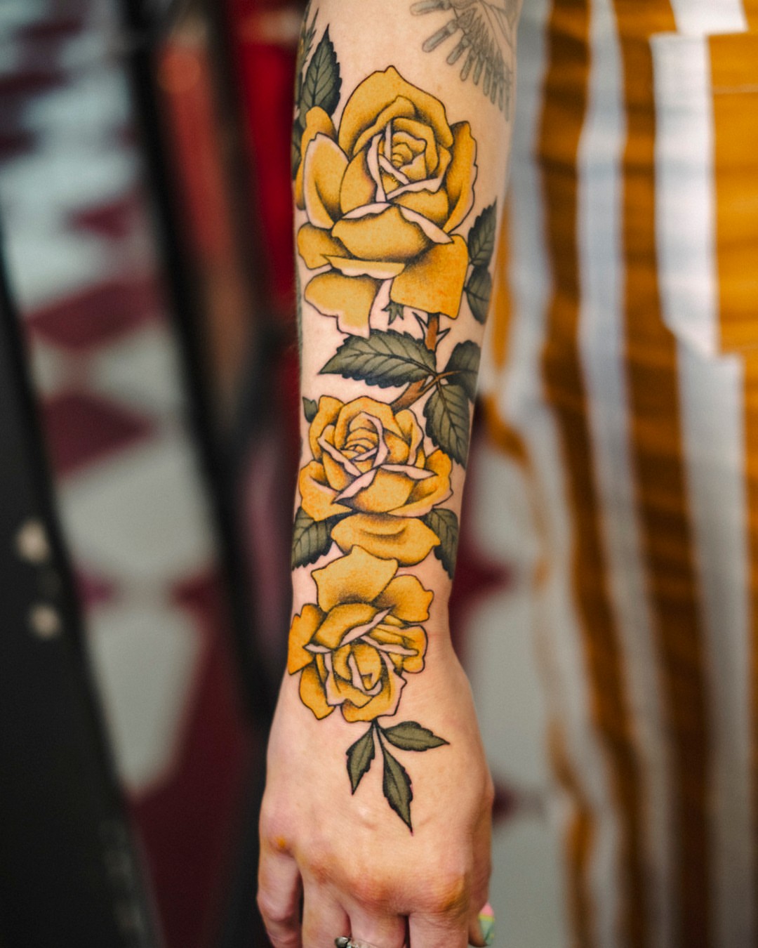 Yellow roses American traditional tattoo on the forearm by Dan Gilsdorf, Portland, Oregon