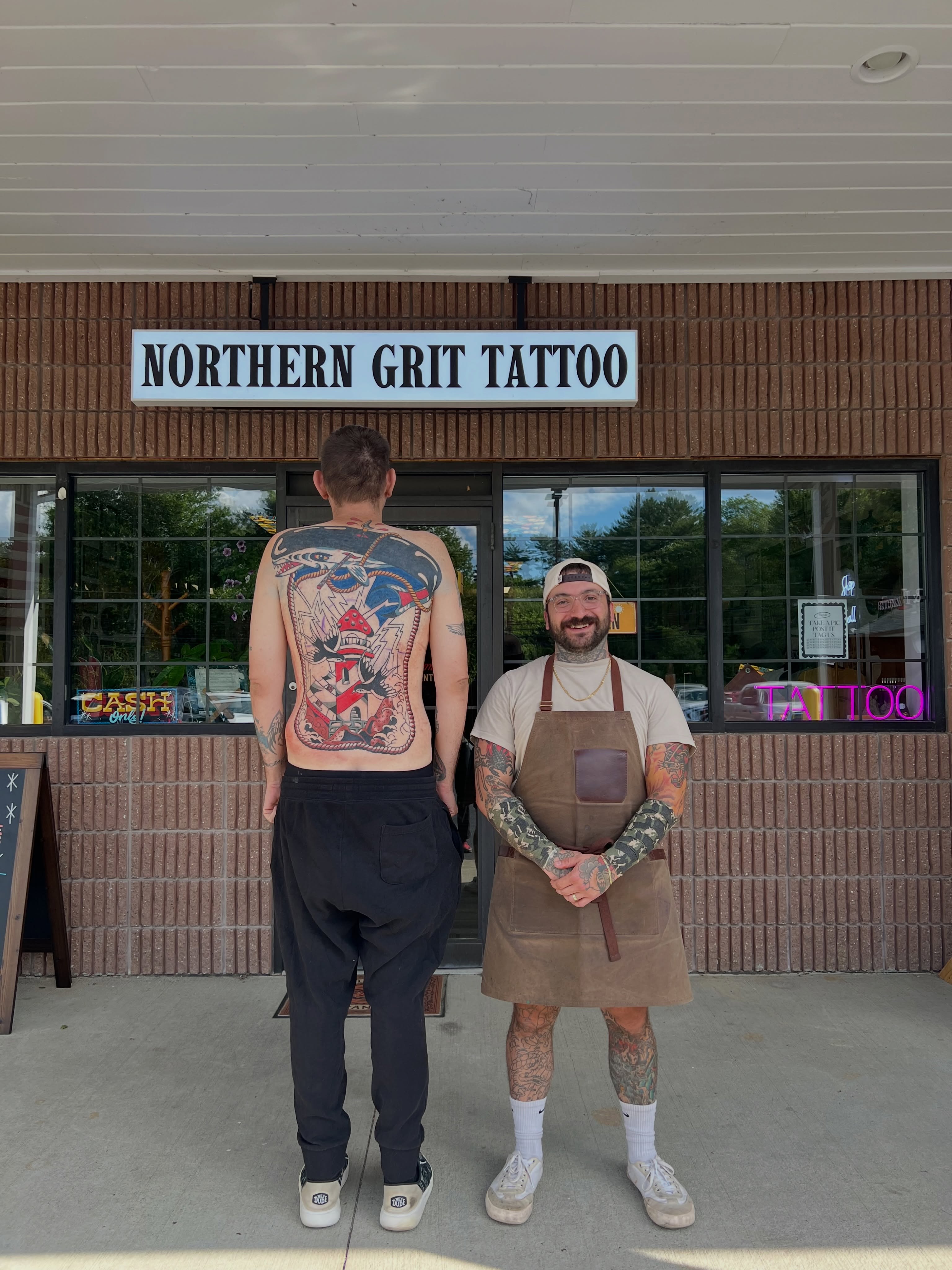 American flag and lighthouse American traditional tattoo on the back by Christopher Durao