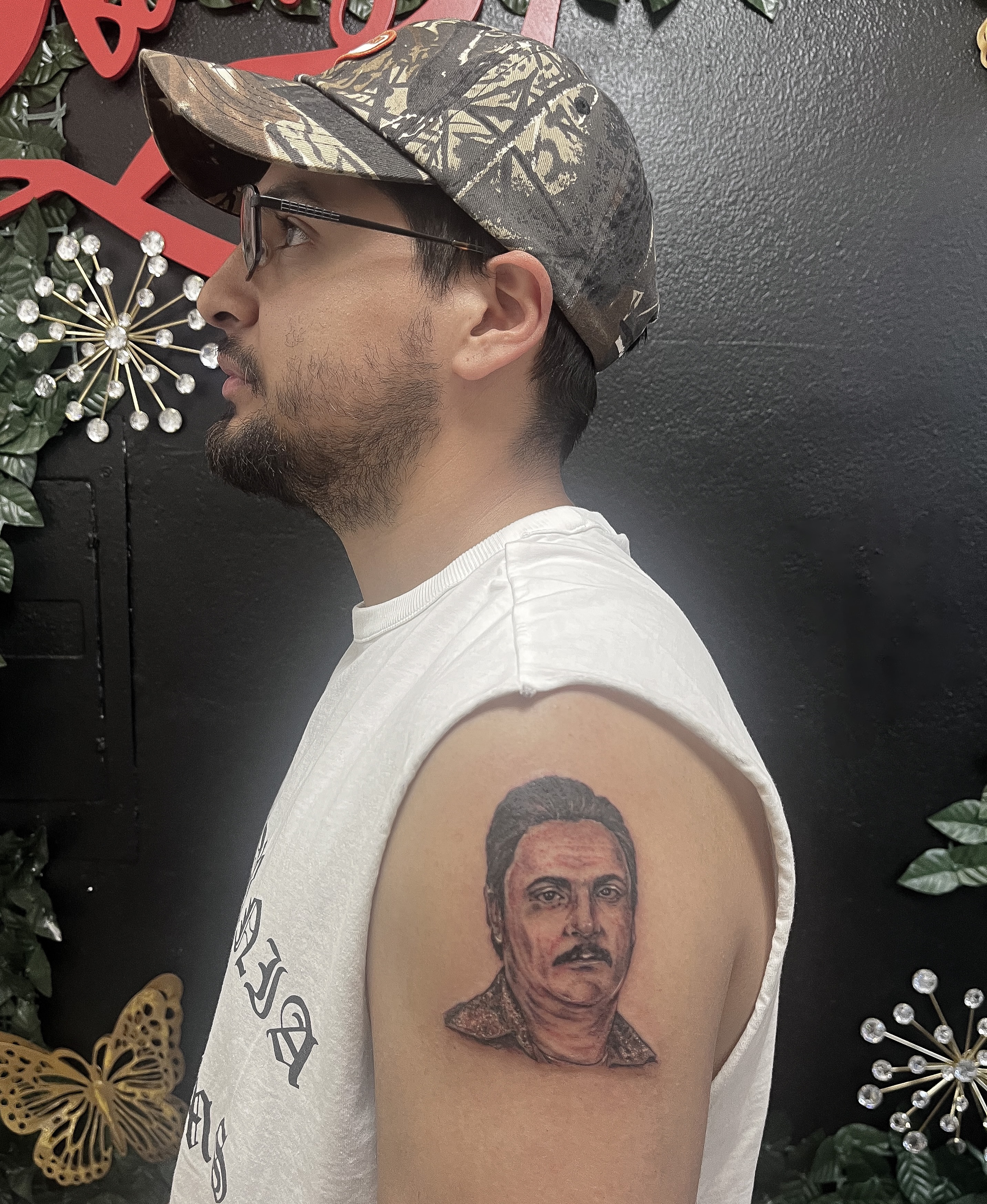 Portrait realism tattoo on the shoulder by Janelle Cuba