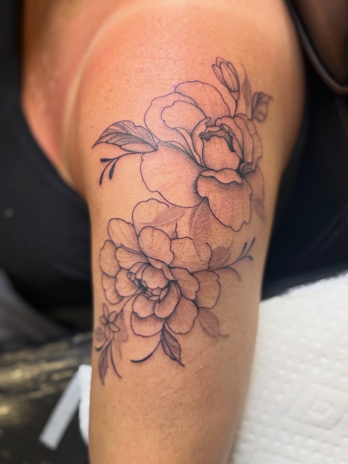 Peony flowers black and grey tattoo on the shoulder by WhoisLaineyTattoos