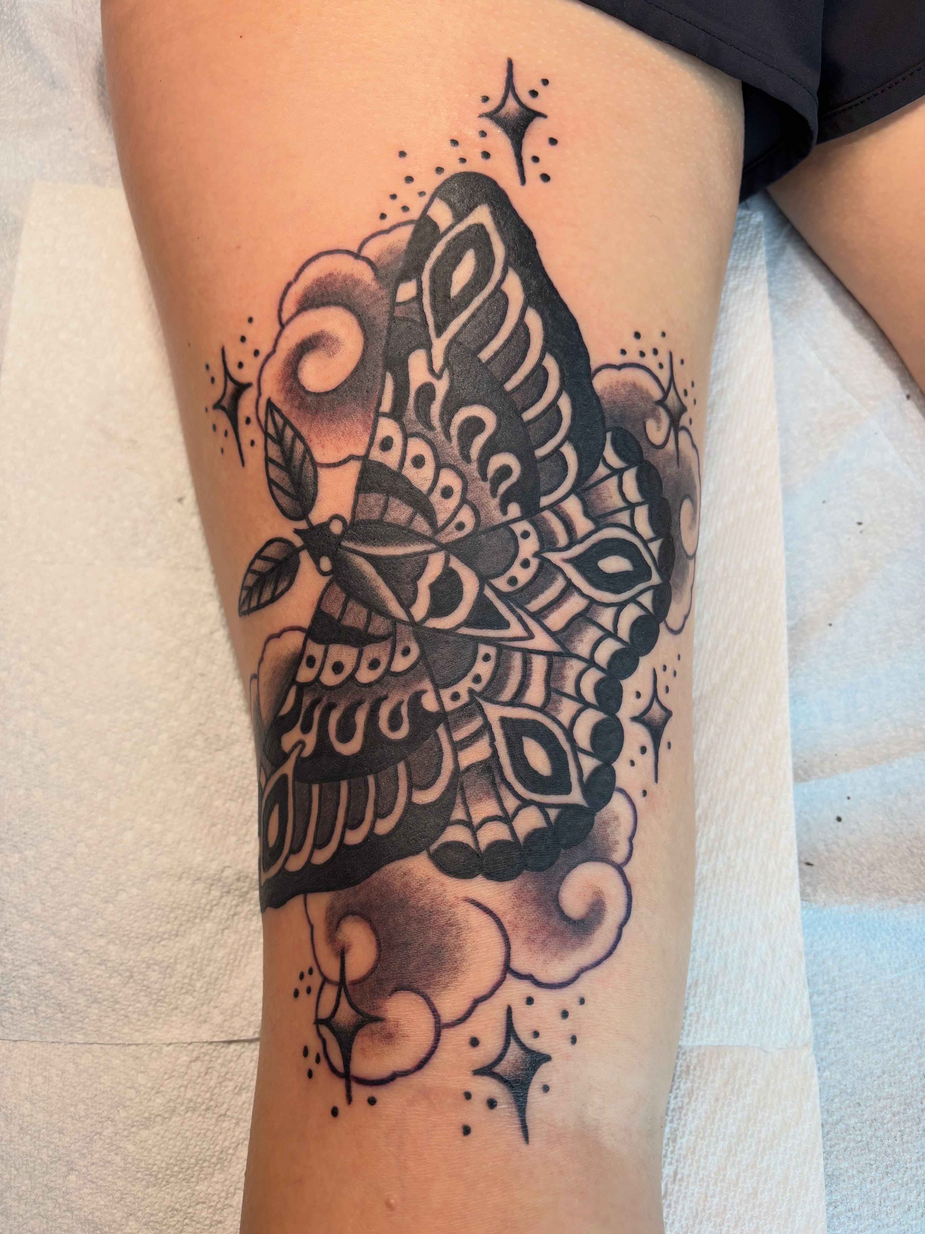 Butterfly American traditional tattoo on the thigh by Jeff Slack