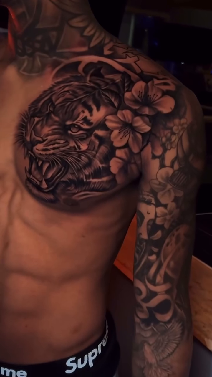 Japanese tattoo on the upper arm by Terrence jones