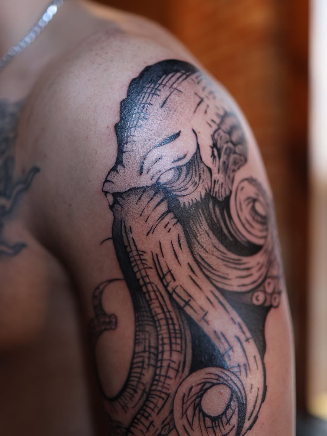 Octopus head and tentacles realism tattoo on the shoulder by morgan purcey