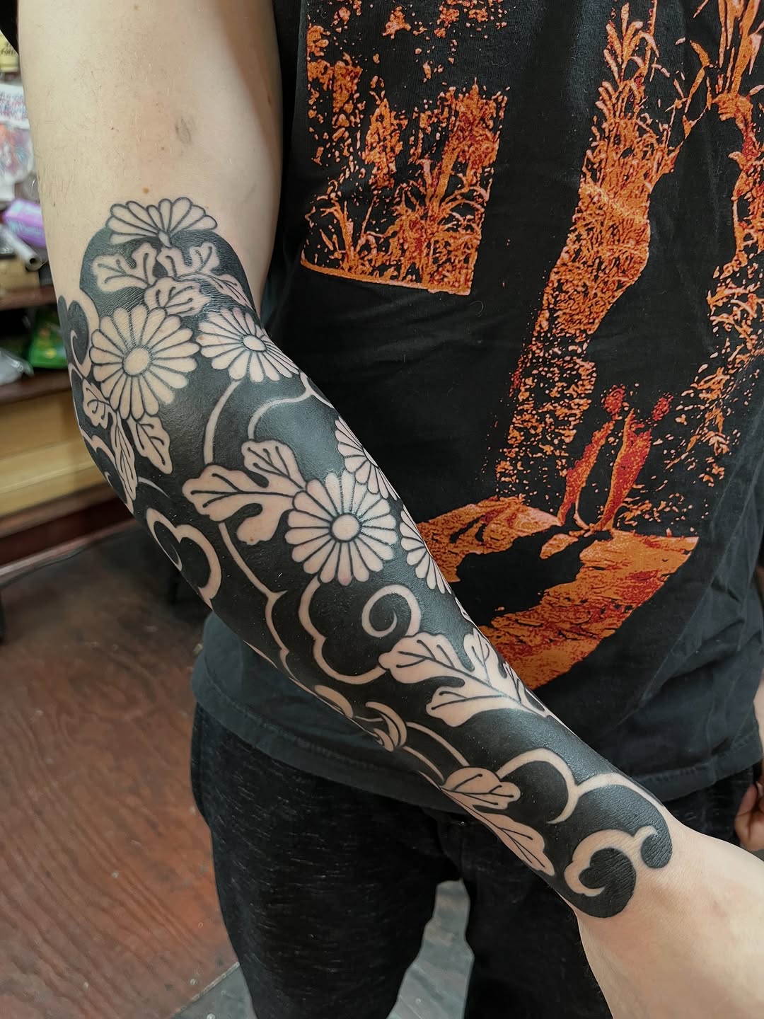Chrysanthemums and clouds Japanese tattoo on the forearm by holly danesi . philadelphia tattoo, Philadelphia, Pennsylvania