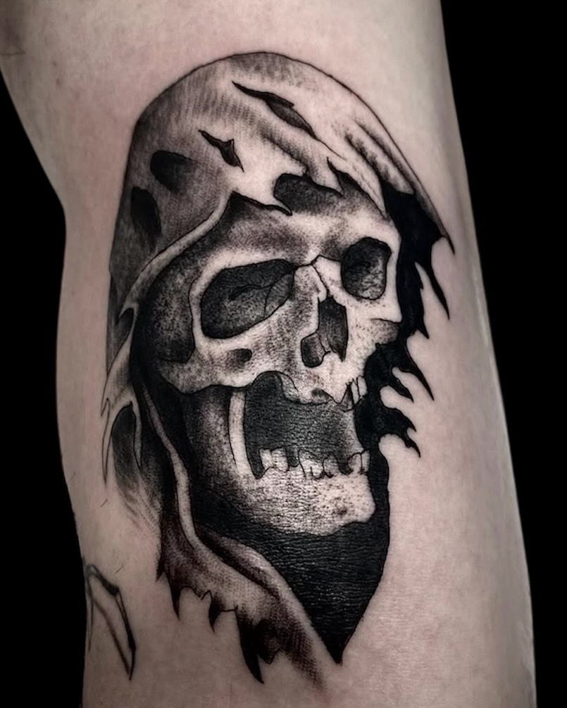 Skull realism tattoo on the forearm by Cody Glenn