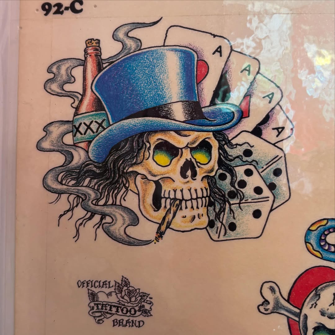 Skull with top hat American traditional tattoo by JD Bassett