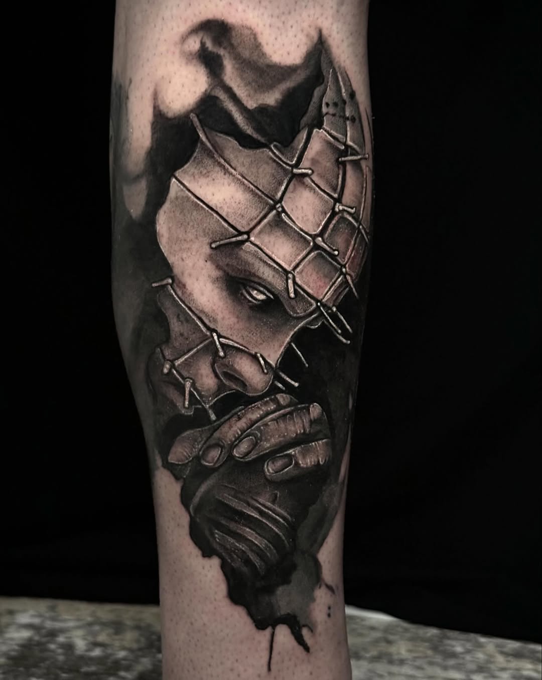 Character with barbed wire mask realism tattoo on the forearm by Mandi Marie, Charlotte, North Carolina