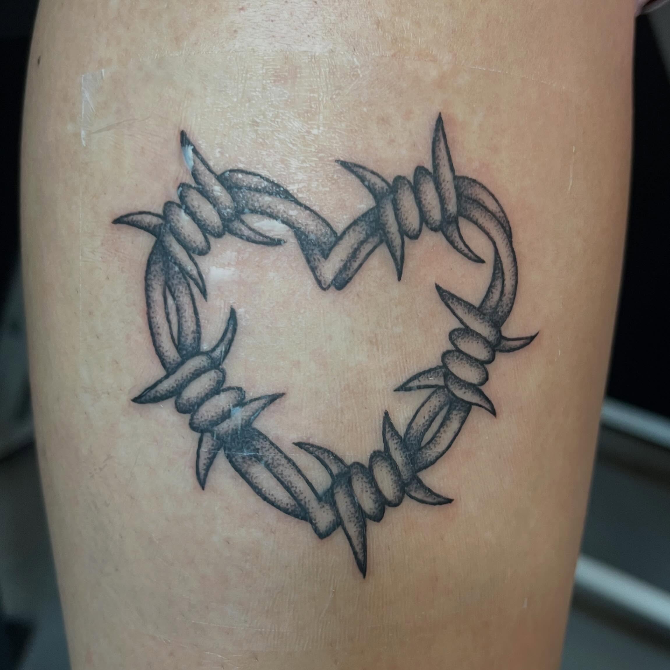 Barbed wire heart cyber sigilism tattoo on the thigh by ⁎⁺˳✧༚Emma