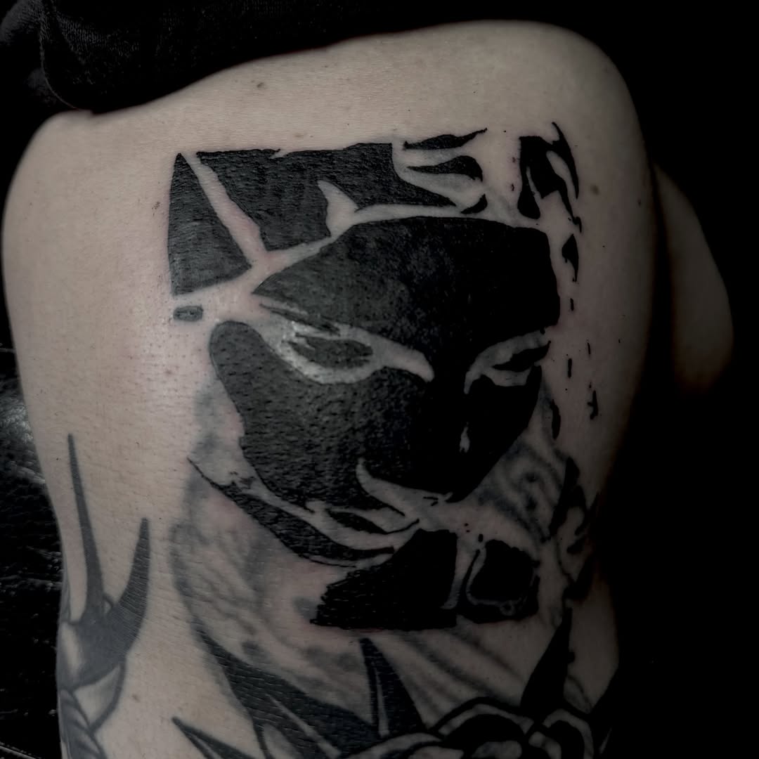 Mask black and grey tattoo on the shoulder by Jordan Sandoval