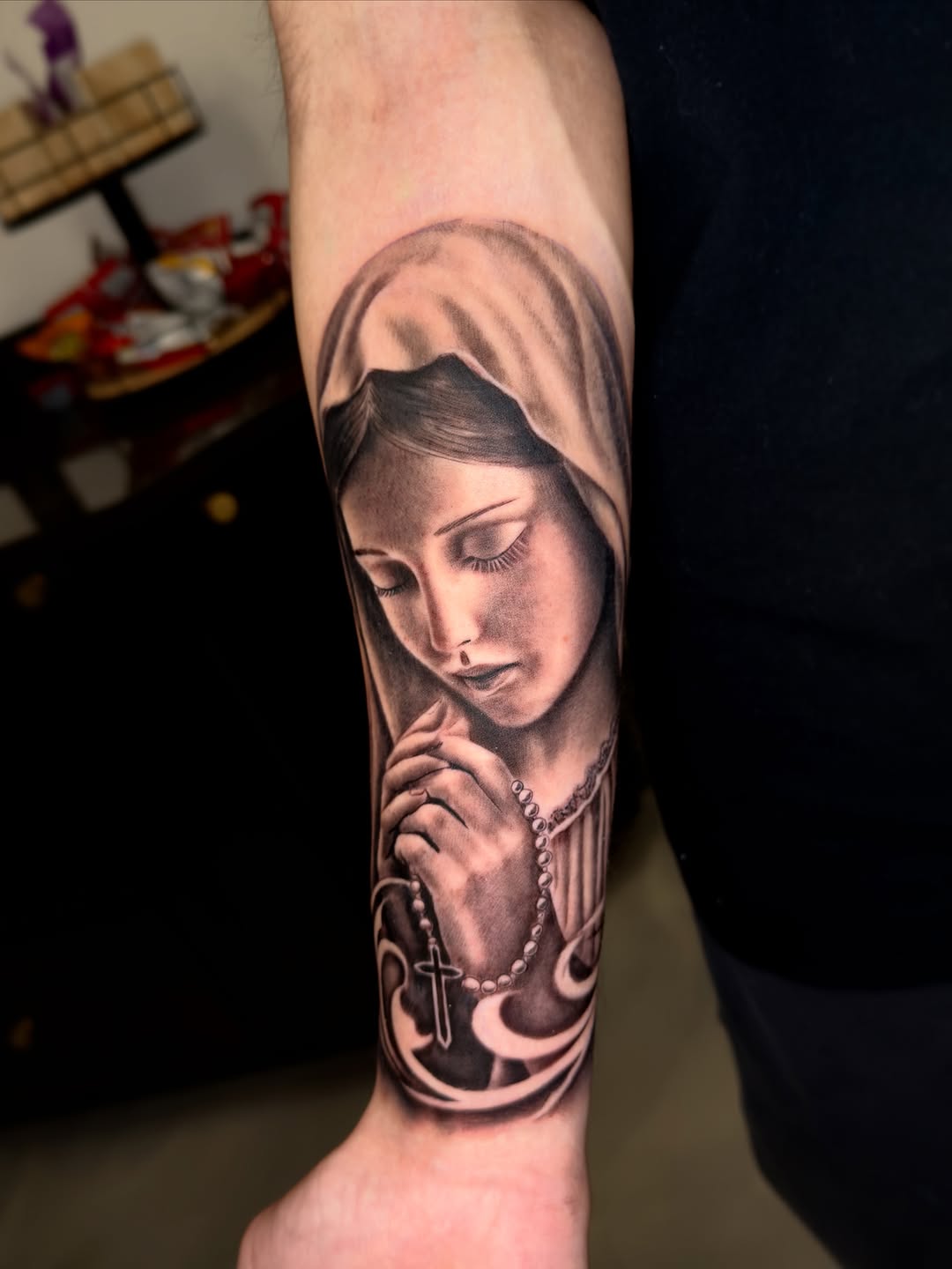 Praying virgin mary with rosary Chicano tattoo on the forearm by Brandon Patino