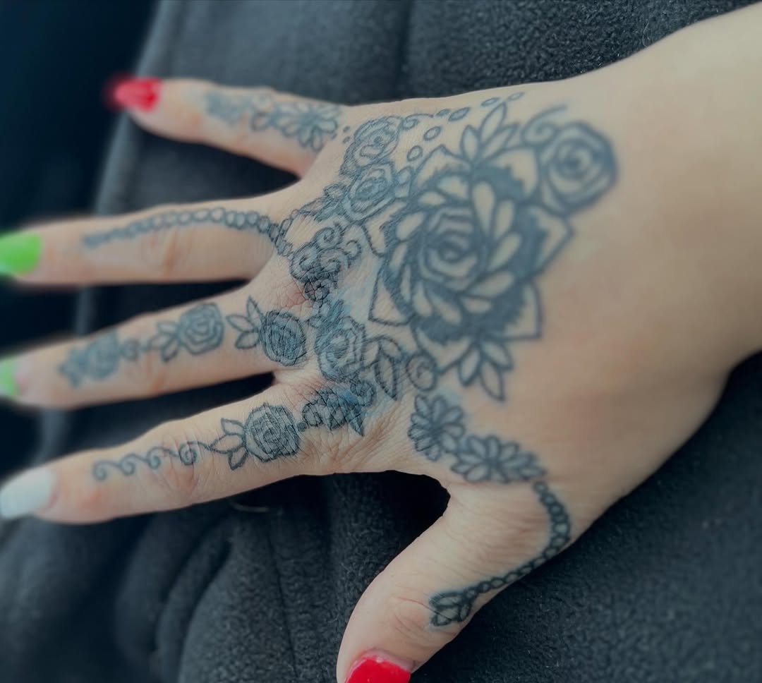 Floral pattern with roses ornamental tattoo on the hand by The feminine ink