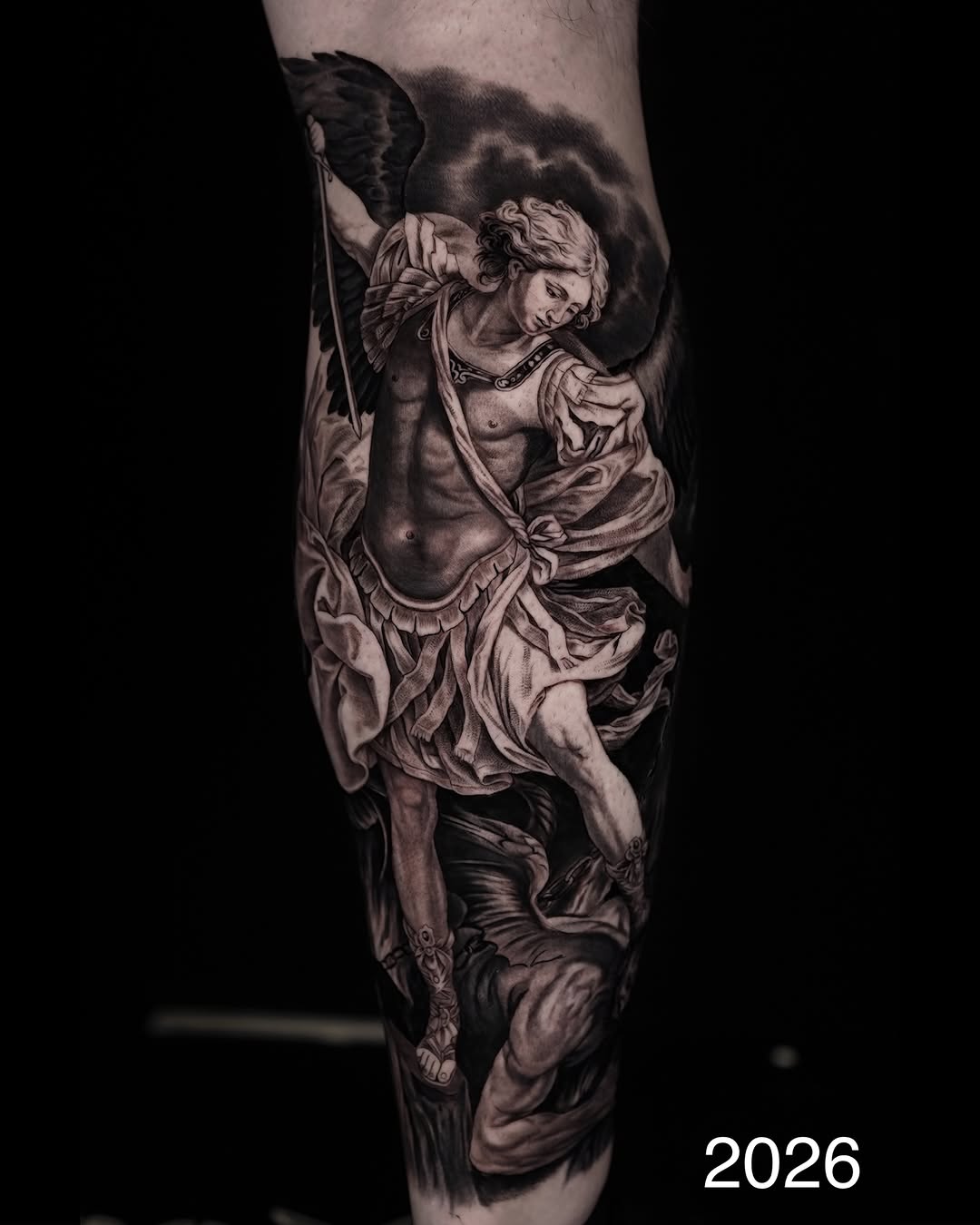 Archangel Michael battling a demon realism tattoo on the forearm by Lynn Hoang, Honolulu, Hawaii