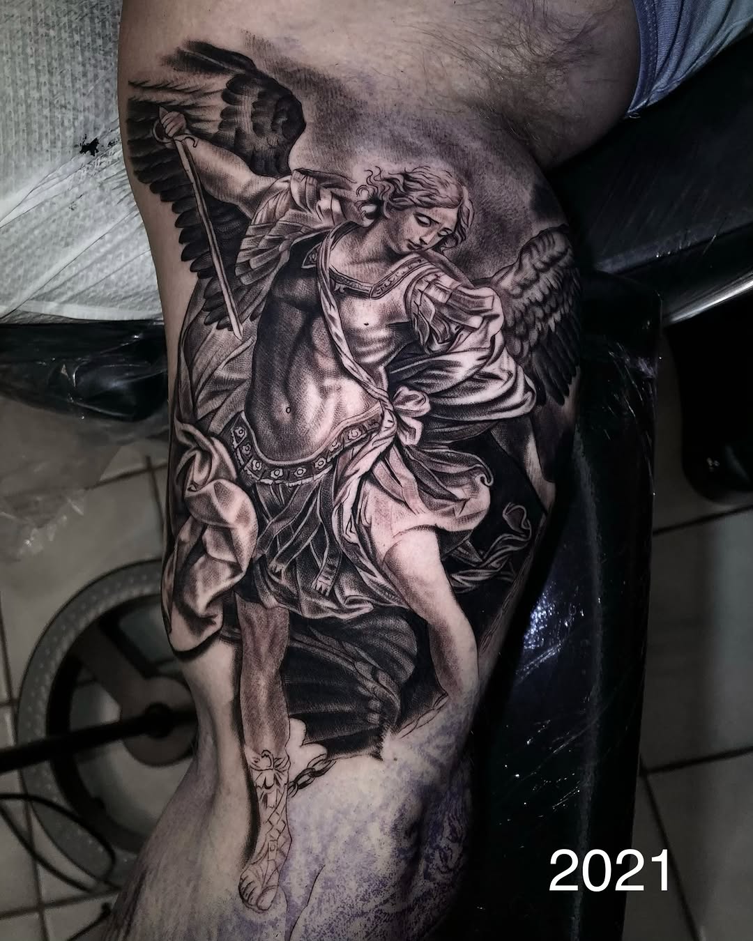 Angel with sword realism tattoo on the thigh by Lynn Hoang, Honolulu, Hawaii
