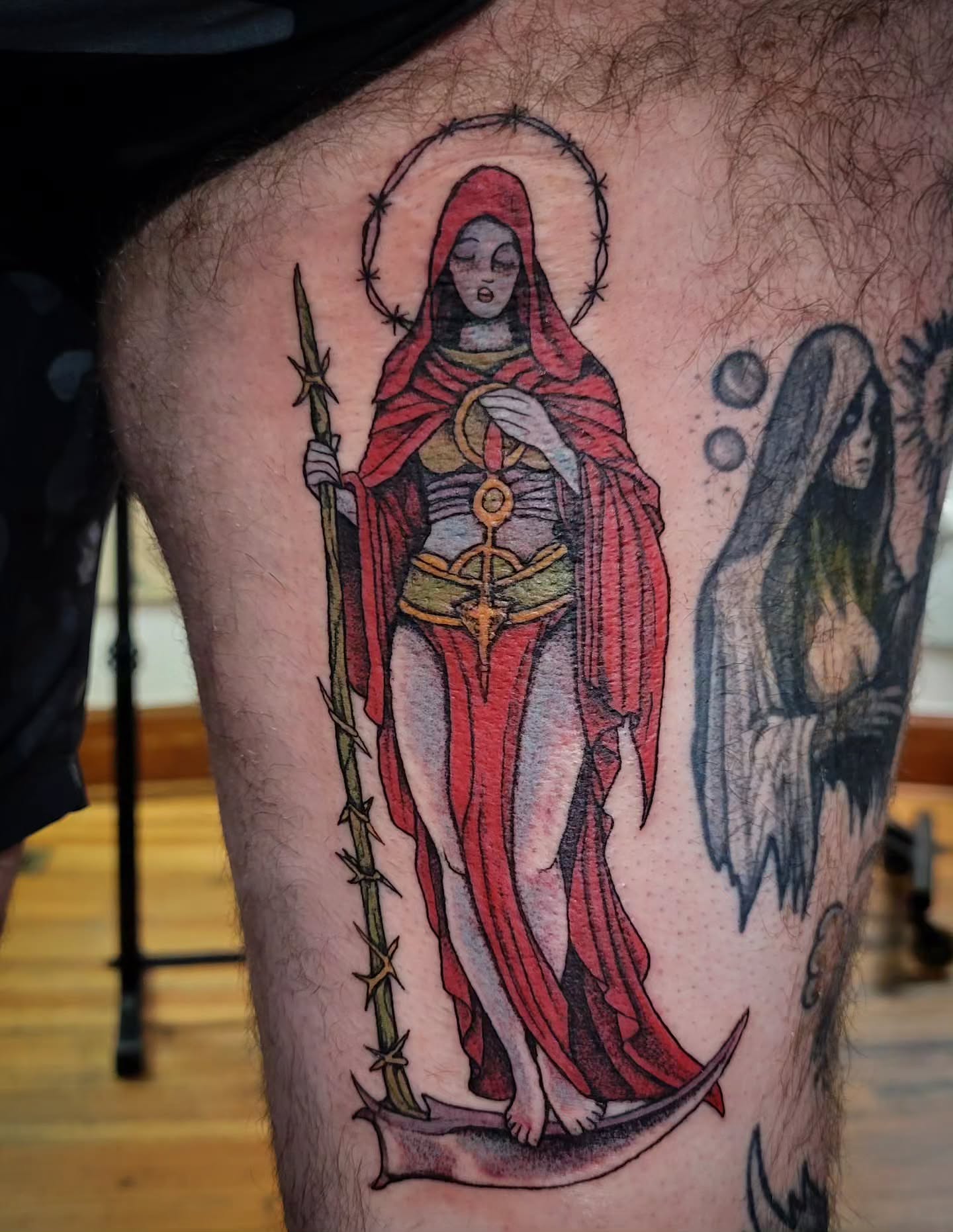 Saint-like figure neo-traditional tattoo on the thigh by brockton a f 💀