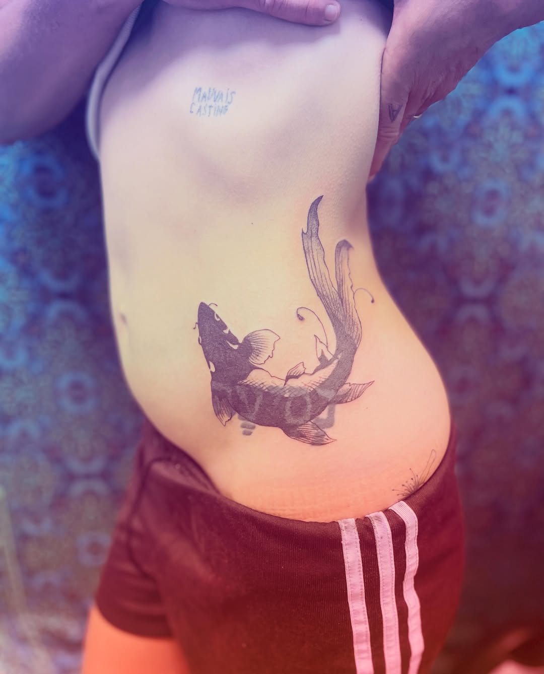 Fish black and grey tattoo on the ribs by La Main Bleue