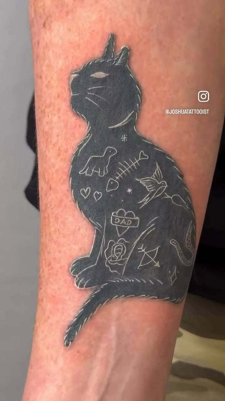 Black cat silhouette with memorial icons realism tattoo on the upper arm by Tattoos By Josh