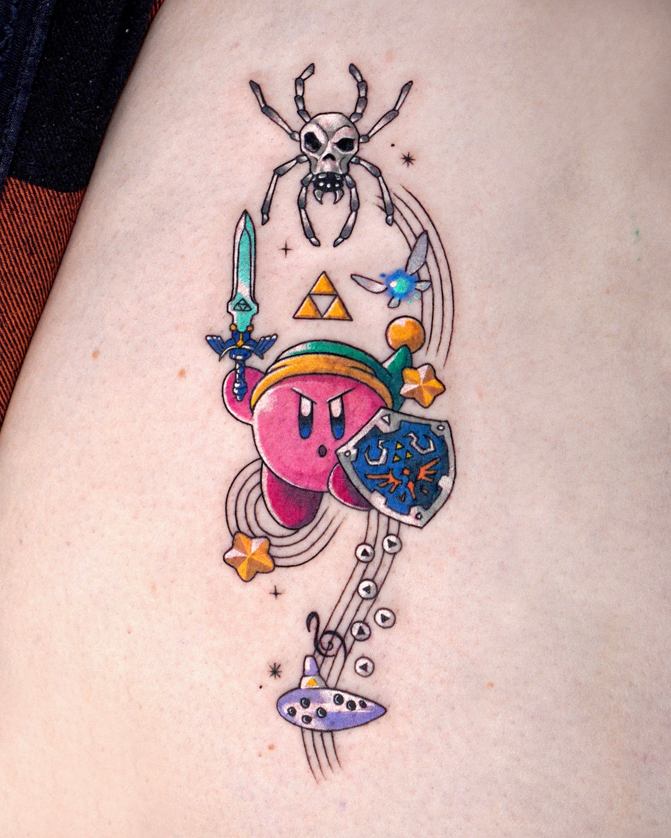 Kirby and Zelda-themed tattoo new school tattoo on the thigh by Eden
