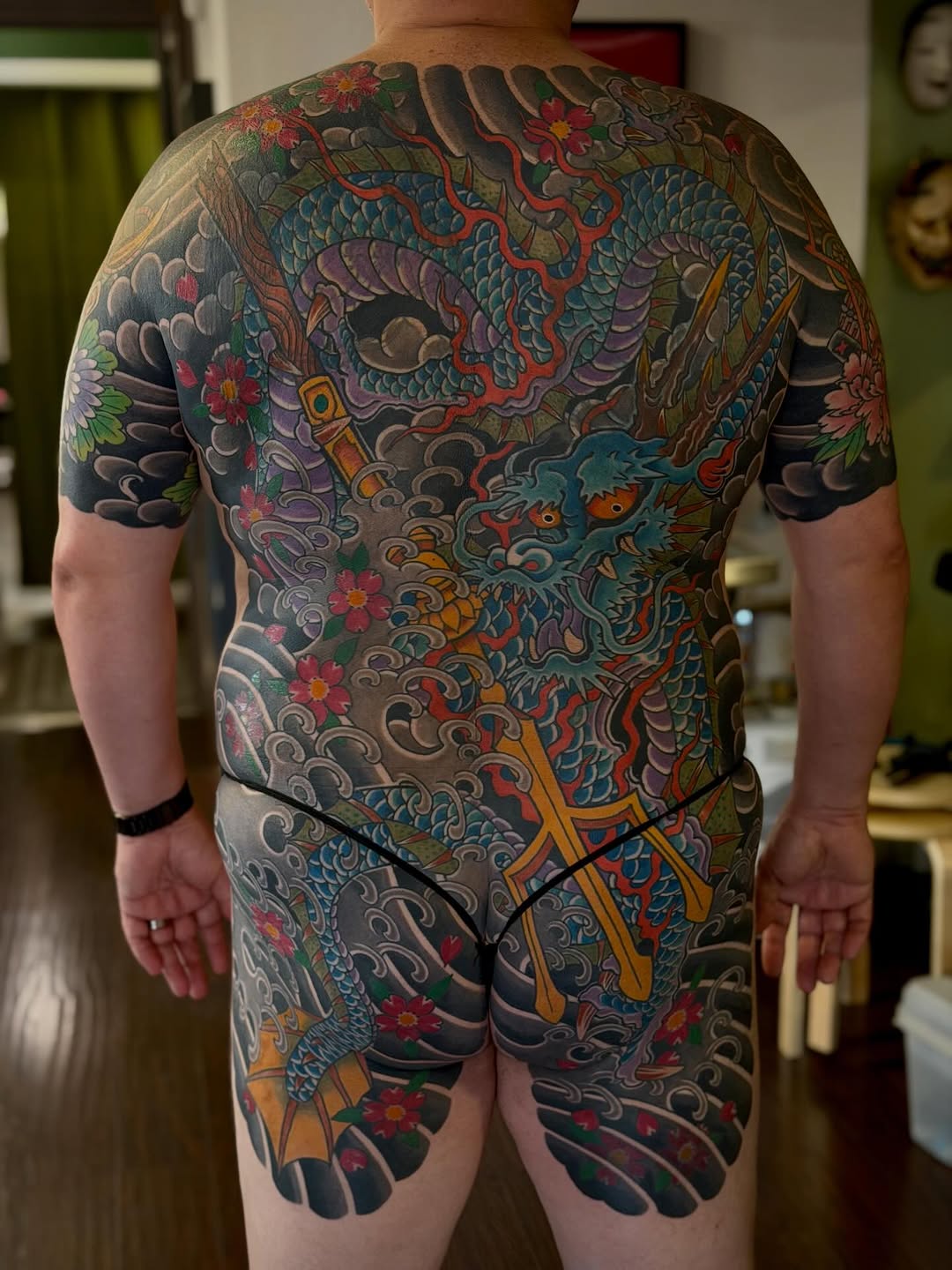 Dragon and flowers Japanese tattoo on the back by Kenny Waizumi ๐