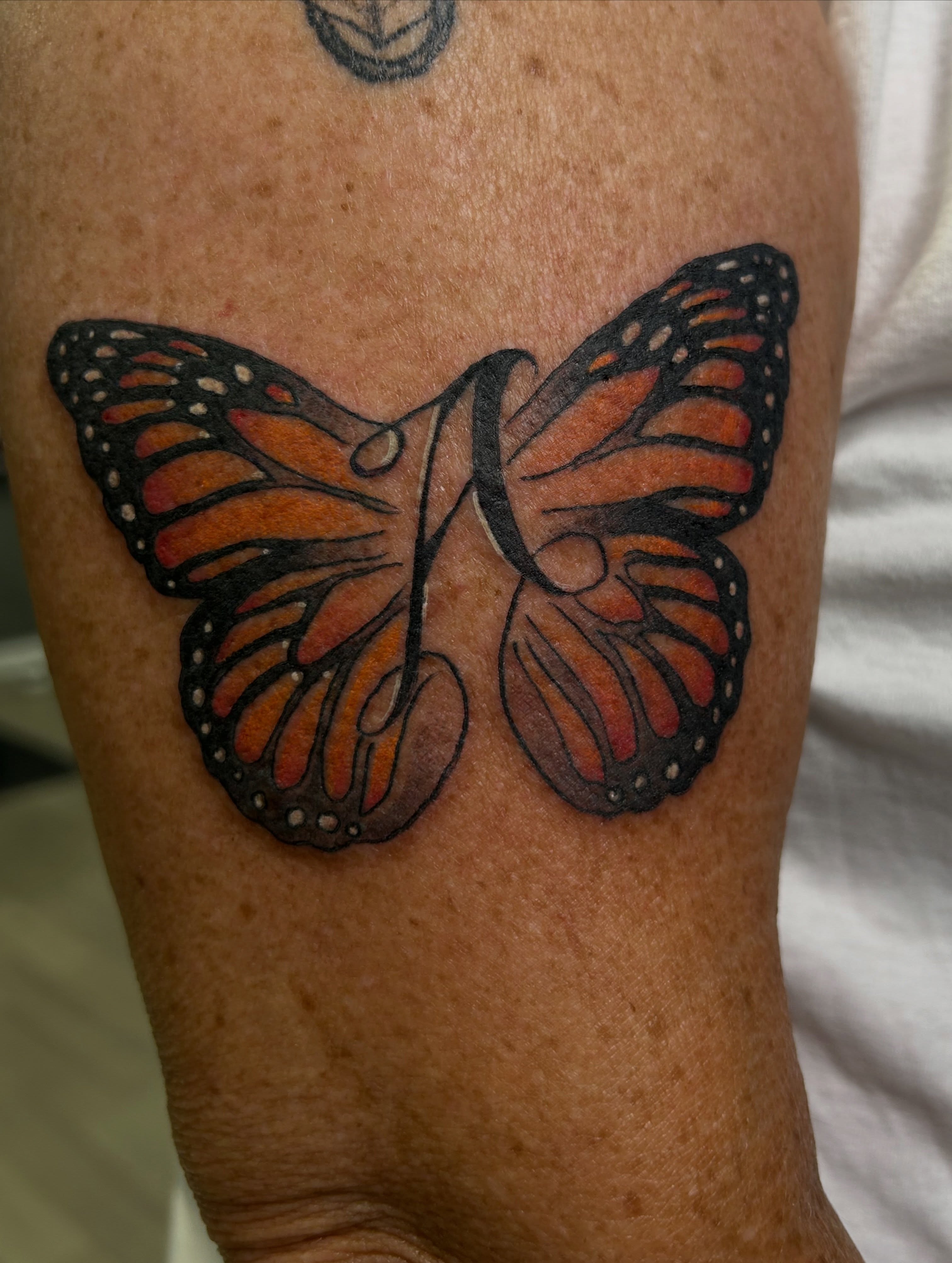 Monarch butterfly dotwork tattoo on the forearm by Erik Sacony